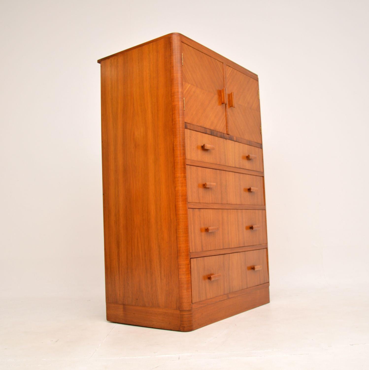 A stylish and very well made Art Deco walnut tallboy chest / cabinet. This was made in England, it dates from the 1920-30’s.

The quality is fantastic, this a great size and has a very useful design. There is lots of storage space, this is generous