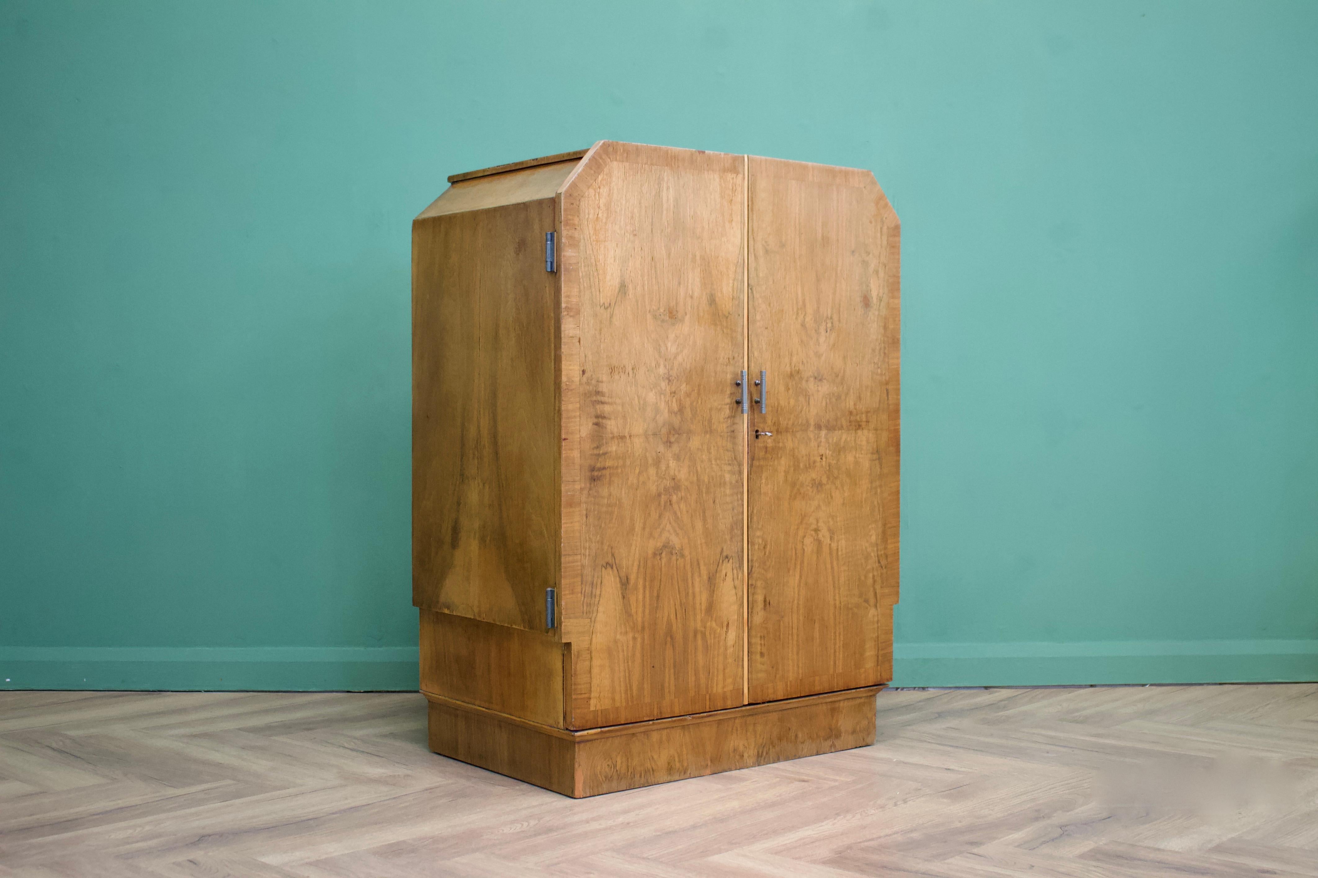 - Art Deco tallboy or linen cabinet
- Made from walnut and walnut veneer
- Painted inside.
  