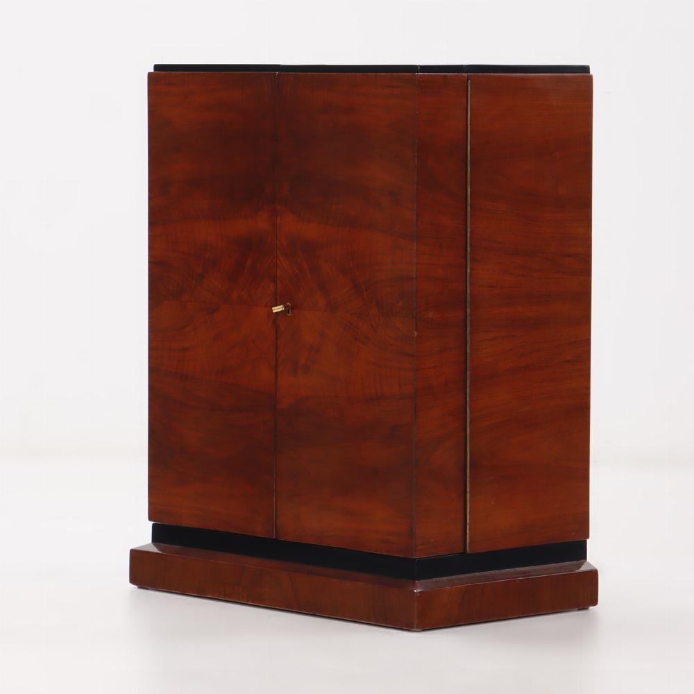 Glass Art Deco walnut two door bar cabinet with ebonized details C 1940. For Sale
