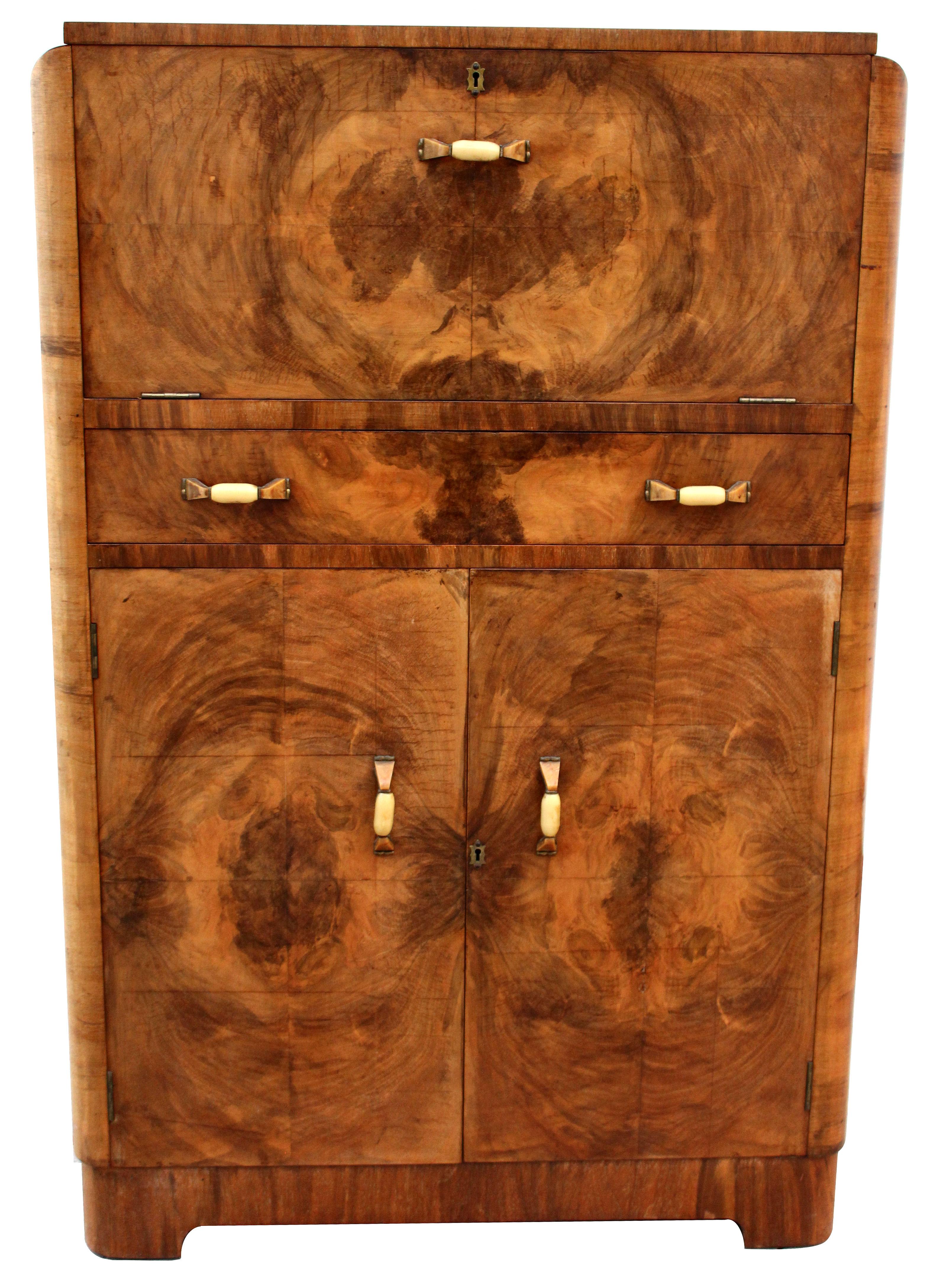For your consideration is this superbly stylish and totally authentic 1930s Art Deco walnut upright cocktail cabinet, every Deco interior should have one of these. Originating from England and dating to the mid-1930s this cabinet offers lots of