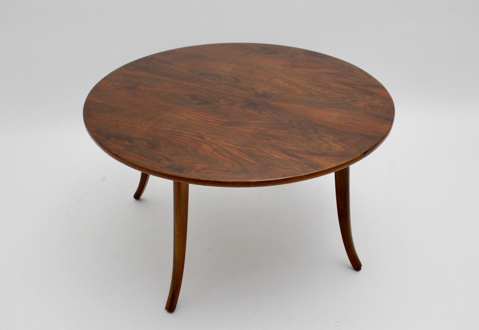 Art Deco trilegged round walnut coffee table by Felix Augenfeld and executed by Karl Schreitel, Wien circa 1927.
This coffee table or sofa table was made of solid walnut and the top is veneered with a beautiful walnut root wood.
Furthermore the