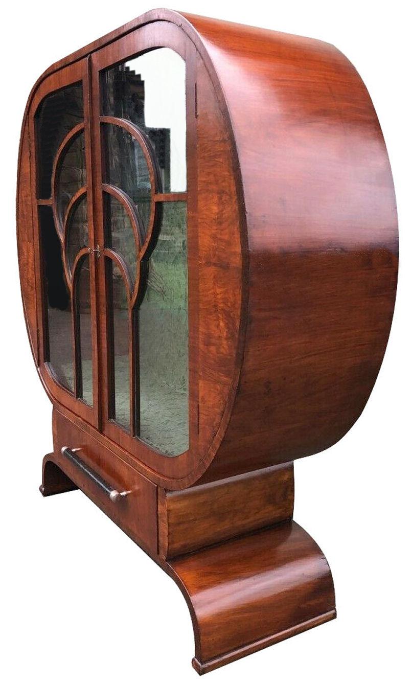 For those seeking originality , rarity and something a little more eye catching than the 'norm' we are pleased to be able to offer you this superb 1930's Art deco Walnut wacky shaped display cabinet, originates from England and is totally original.