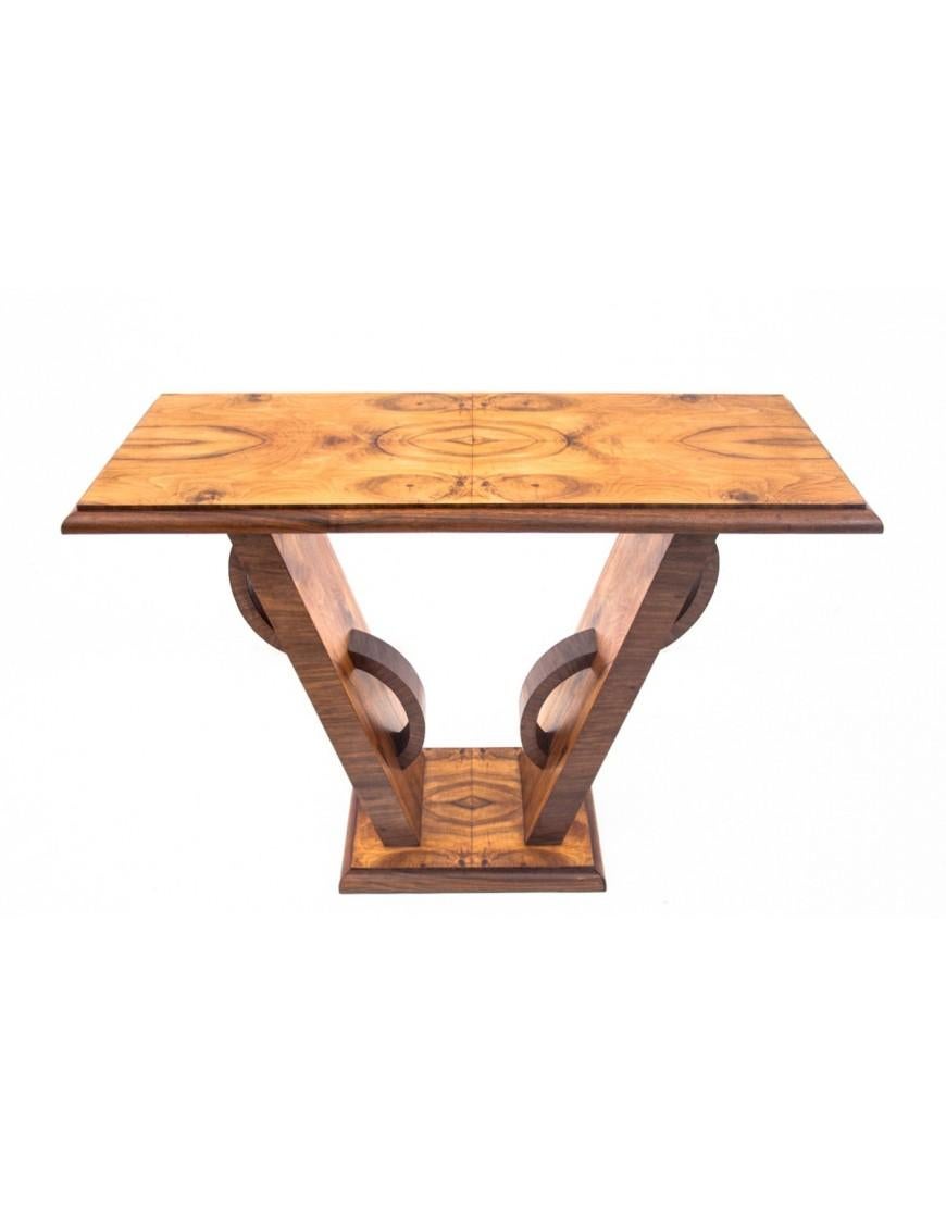 Console table made of walnut wood in a unique Art Deco style.

Furniture manufactured in Poland in the mid-20th century. The entire console is veneered with walnut with rich grain. Beautiful form that will enrich the interior. The console can be