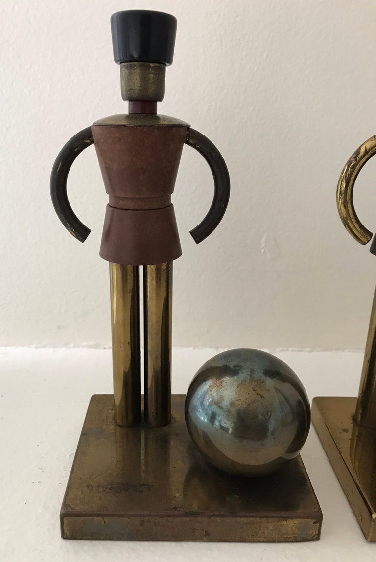 Very rare pair of Walter Von Nessen toy soldier bookends in brass and bakelite. All original with beautiful patina and age. Hallmarked. Very slight separation at one corner, see photo.