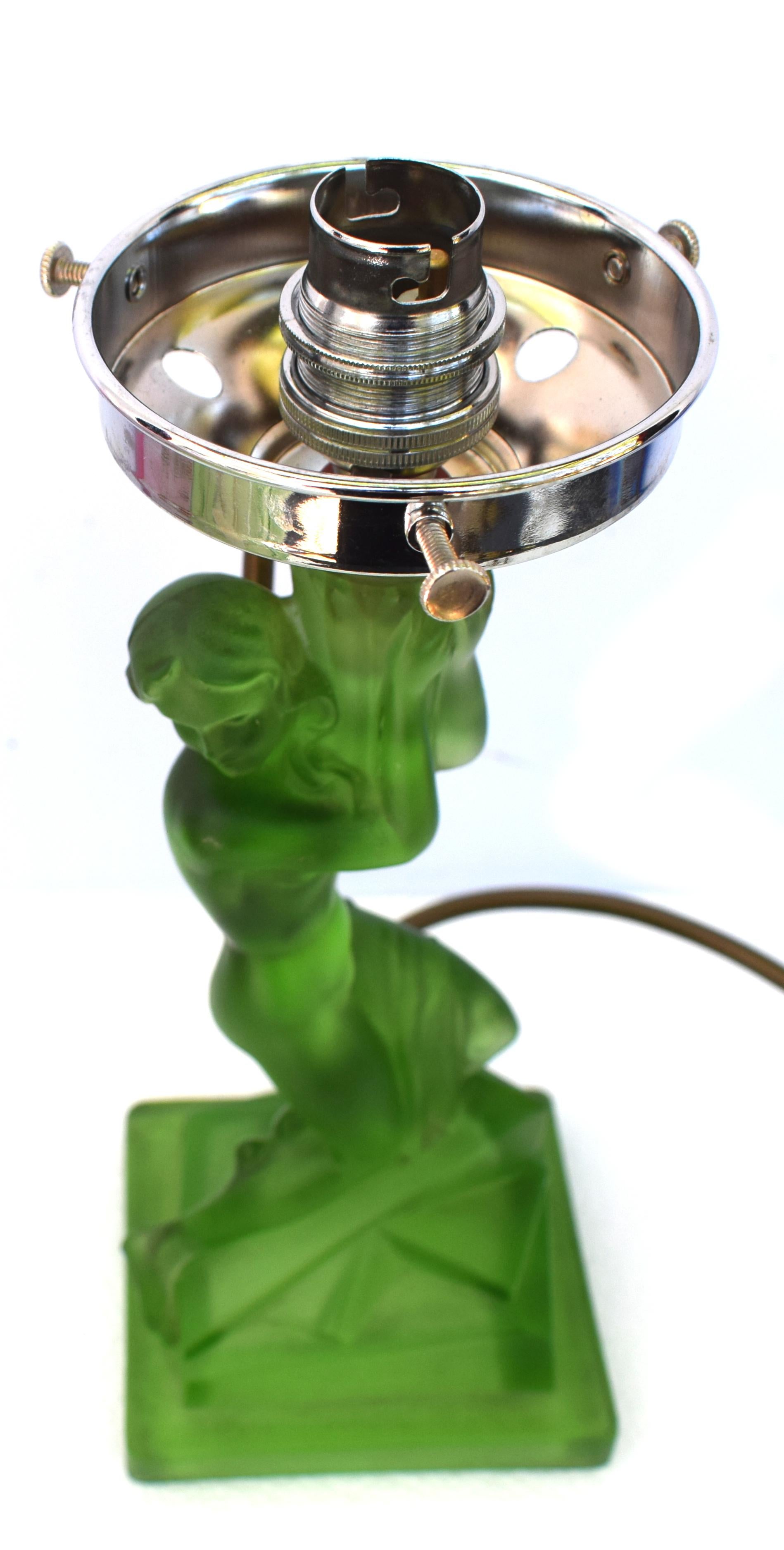 For your consideration is this tall and very elegant and original Walther and Sohne amber glass table lamp, circa 1930s. Features female nude to create the column of the lamp with a segmented glass shade. The green colored glass in excellent