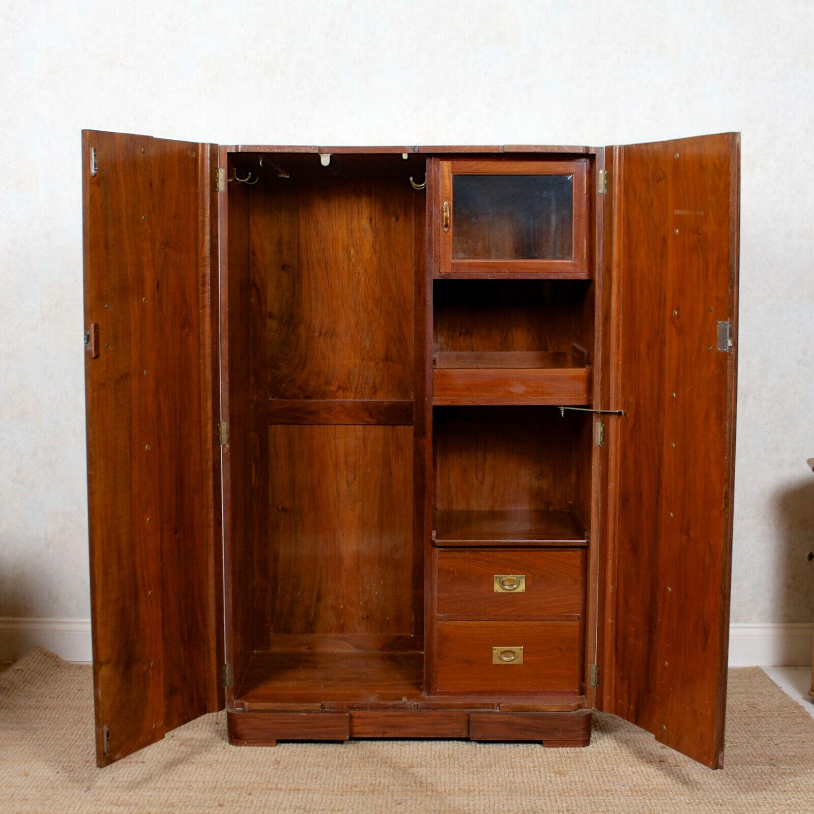 A fine quality Art Deco bird’s-eye maple compactum wardrobe.
The inlaid doors mounted with good handles and enclosed a fitted interior comprising hanging rail, hooks, shelving, glazed cupboard, tray and drawers mounted with good brass inset