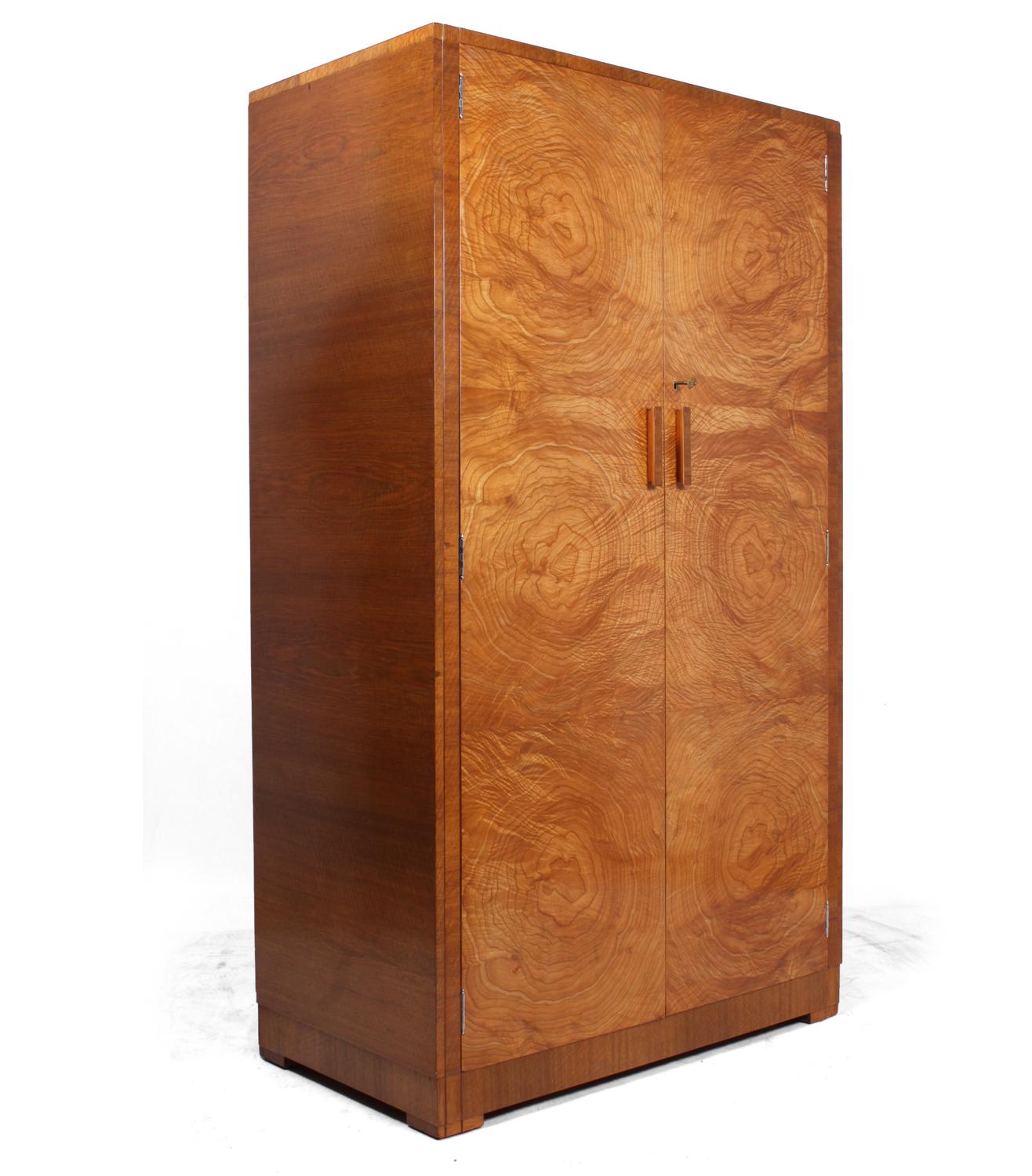 Art Deco wardrobe in satin birch
A two-door Art Deco gentleman's wardrobe possibly by Heal's, in satin birch with shelves behind and hanging rail to the left the wardrobe is in excellent condition throughout.

Age: 1930

Style: Art