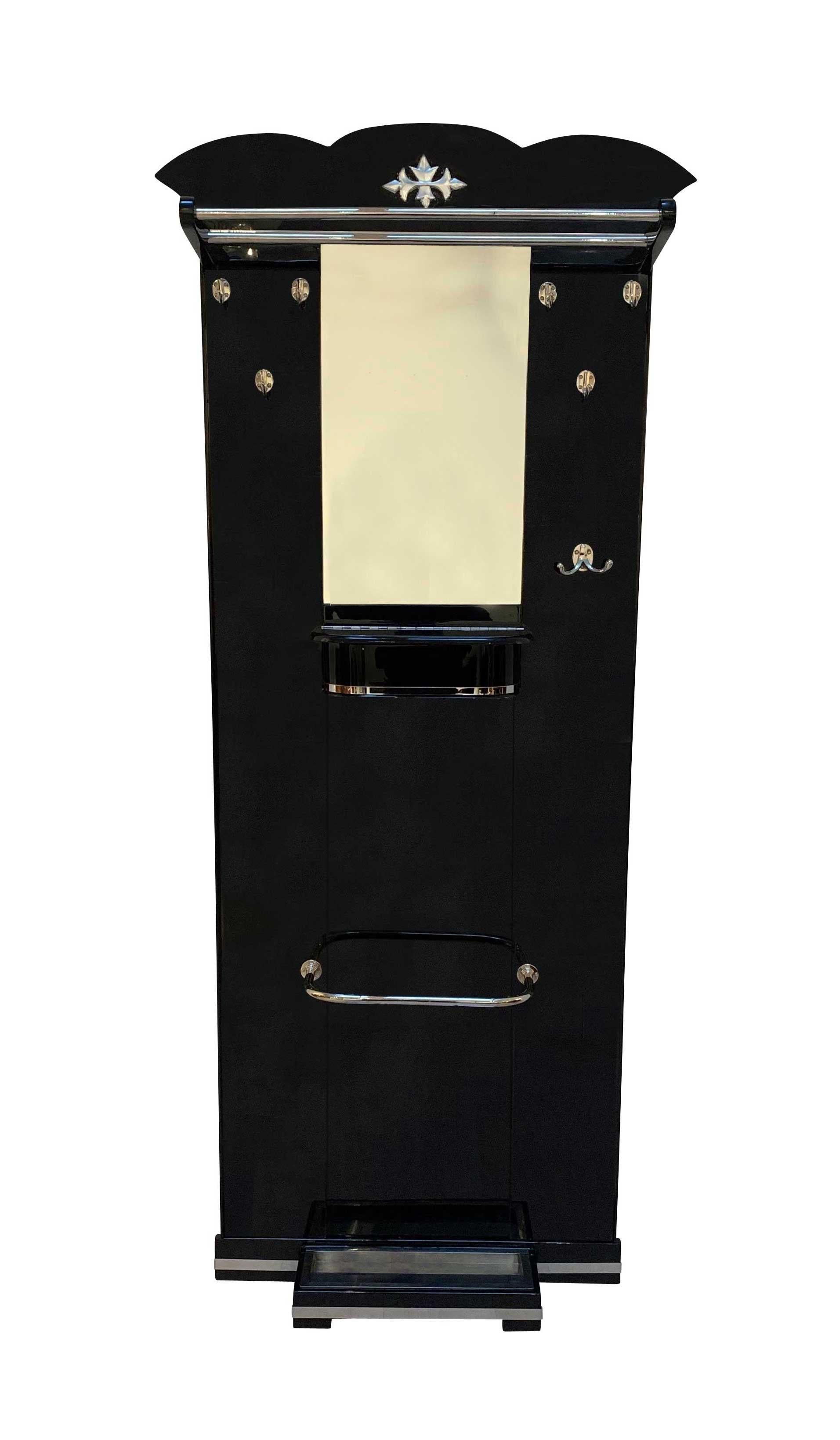 Beautiful Art Deco Wardrobe from France about 1920s.

Excellently restored. With mirror and closed compartment. Black lacquer on Oak solid wood with beautiful nickel-plated metal hardware.

Oak solid wood, coated with black piano lacquer and
