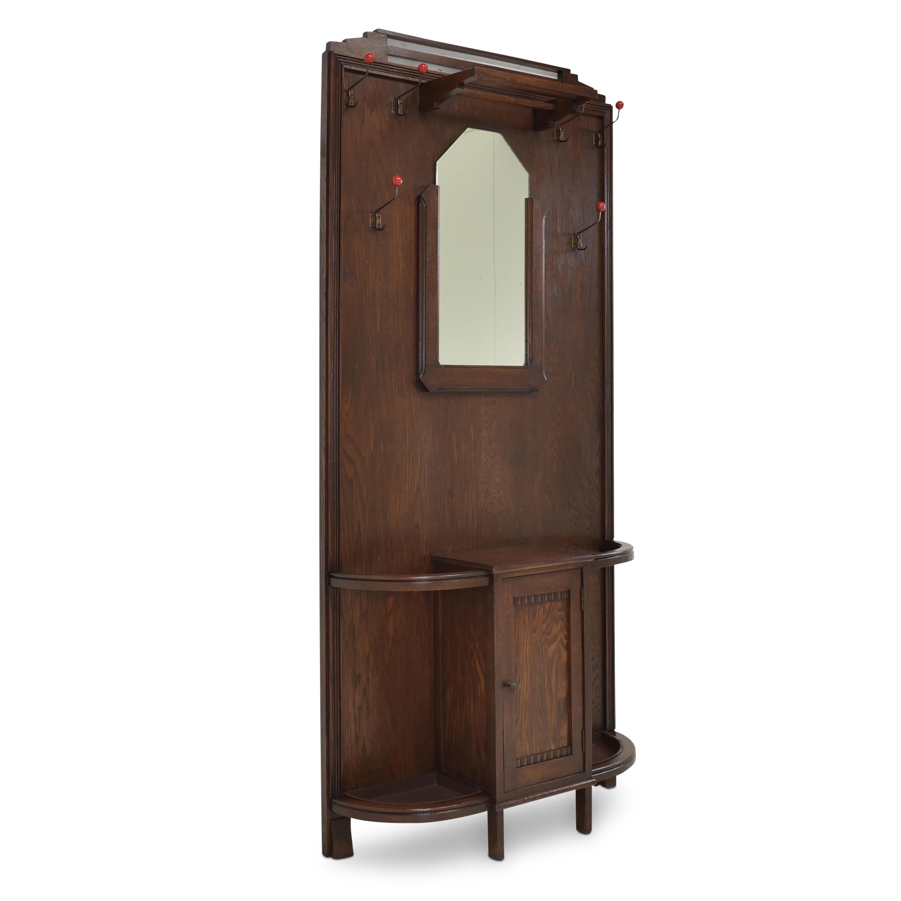 Wardrobe restored Art Deco around 1930 Oak wall wardrobe

Features:
With mirror, hooks, umbrella stands, hat rack and cupboard
Geometric shape
Original fittings
Beautiful patina

Additional information:
Material: Partly solid