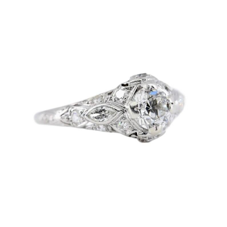 Aston Estate Jewelry Presents:

An Art Deco period diamond engagement ring in luxurious platinum. Centered by a sparkling 0.70 carat old European cut diamond of H color and VS2 clarity. The handmade mounting accented with 0.50ctw of old Marquise,