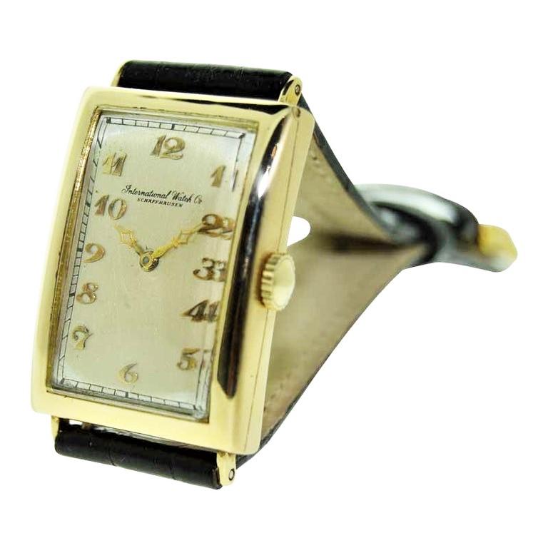FACTORY / HOUSE:  I.W.C. / International  Watch Company
STYLE / REFERENCE: Tank Style
METAL / MATERIAL: 18Kt
DIMENSIONS:  Length 41mm X Width 25mm
CIRCA: 1930s
MOVEMENT / CALIBER: Manual Winding / 19 Jewels 
DIAL / HANDS: Original Silvered with