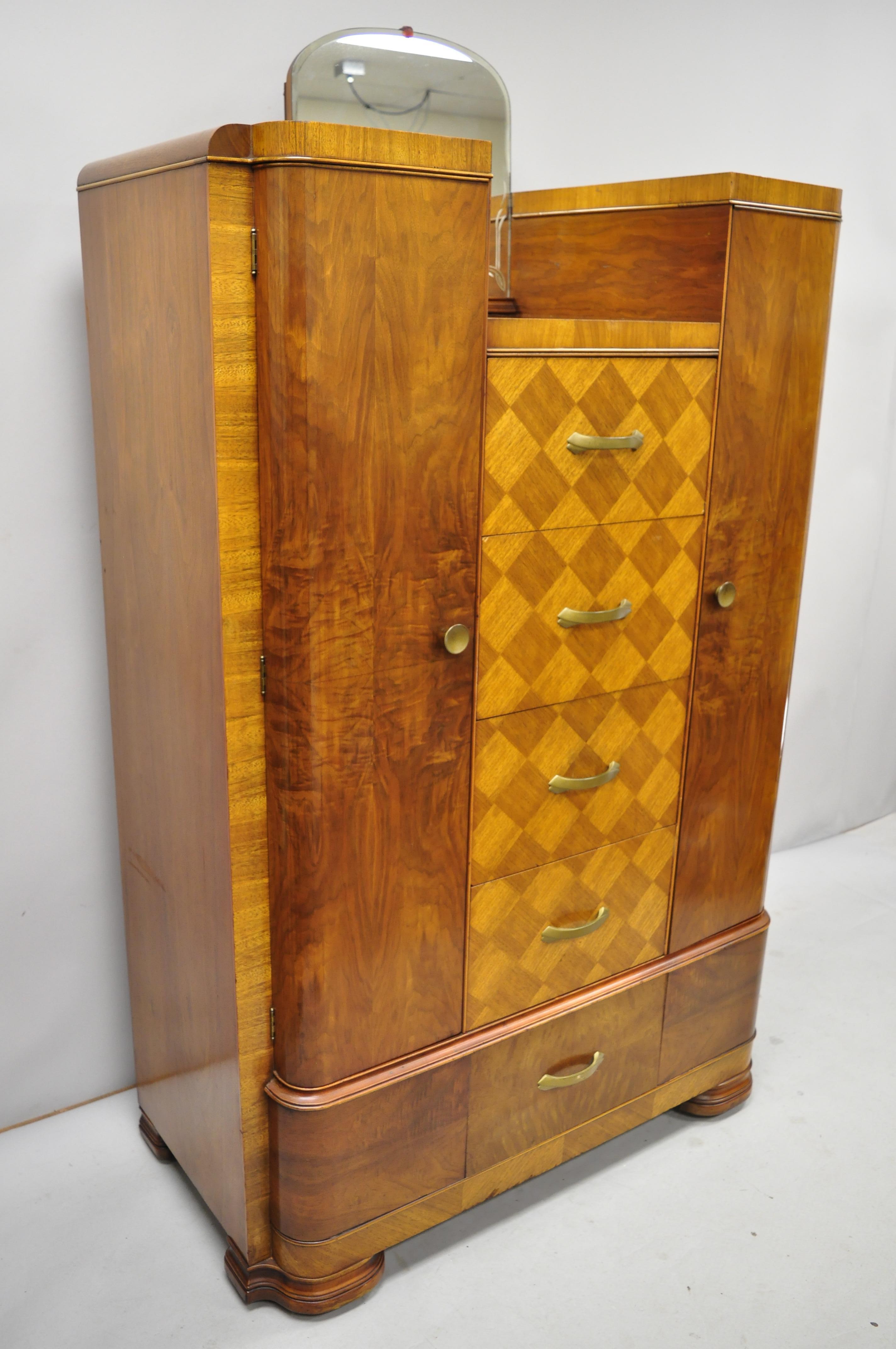 Art Deco Waterfall chest dresser armoire wardrobe cedar chest with mirror by tri-bond. Item includes cedar lined cabinets, etched mirror, beautiful wood grain, 2 swing doors, 5 dovetailed drawers, very nice antique item, circa early 20th century.