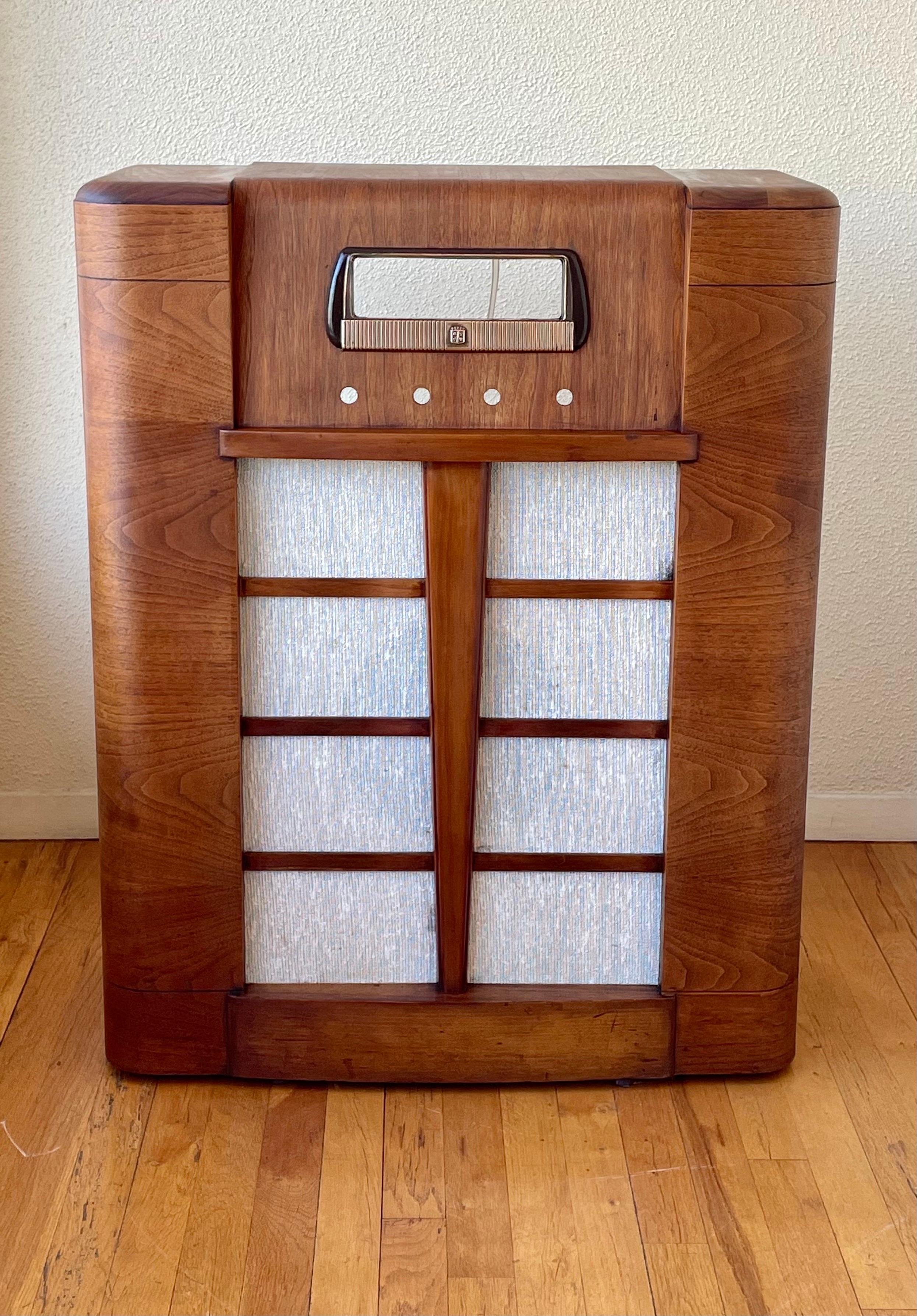 A very cool and unique piece can be used as a bar or place your stereo equipment inside we refinished the piece a very unique item it comes with its original speaker.