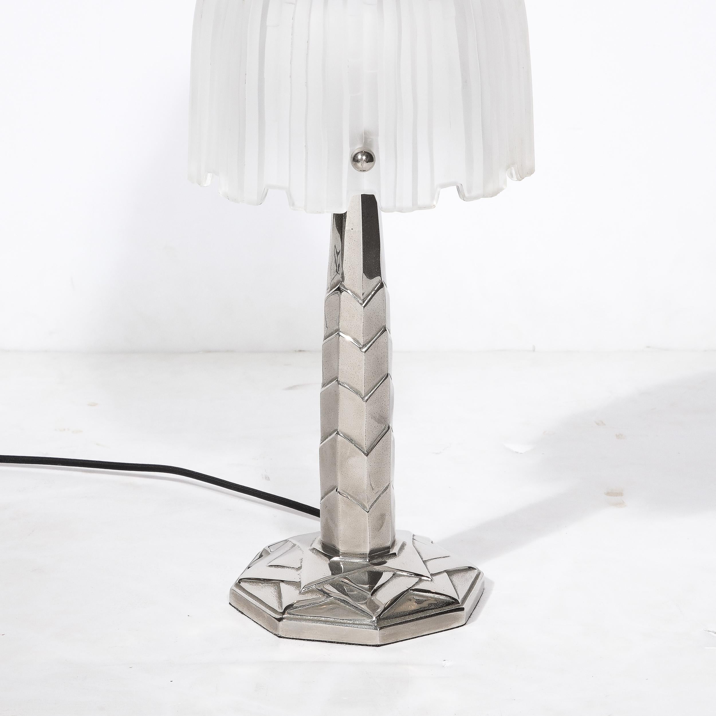This stunning table lamp was designed by Marius-Ernest Sabino in France, Circa 1930. An industrial designer known for his futuristic, angular and geometric designs. The Lamp is signed Sabino, who was a French artist who worked with glass and all