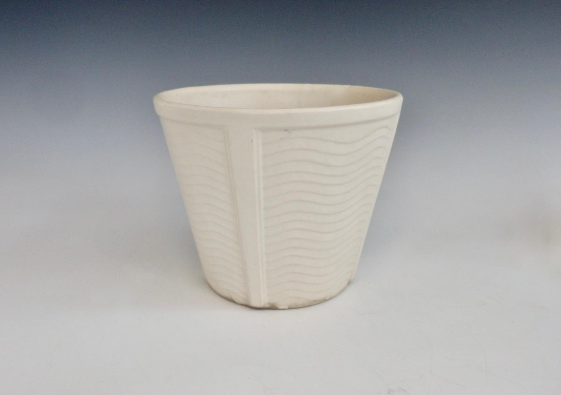 Substantial body Art Deco styled planter pot. Tapers up from 6.75