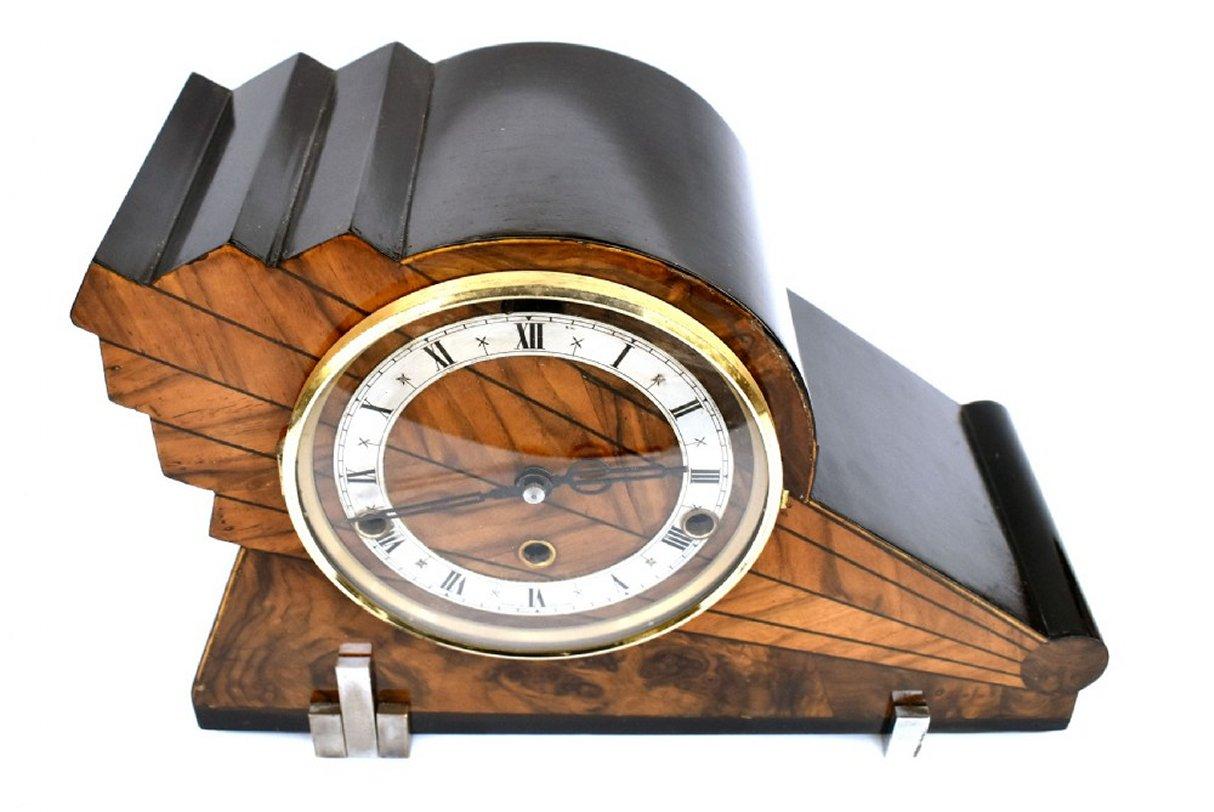 For your consideration is this very stylish 1930's Art Deco Westminster chime clock made in England. Multi toned walnut veneers with ebonised surround and a with geometric lightening shape to form the case this clock really does make a statement .
