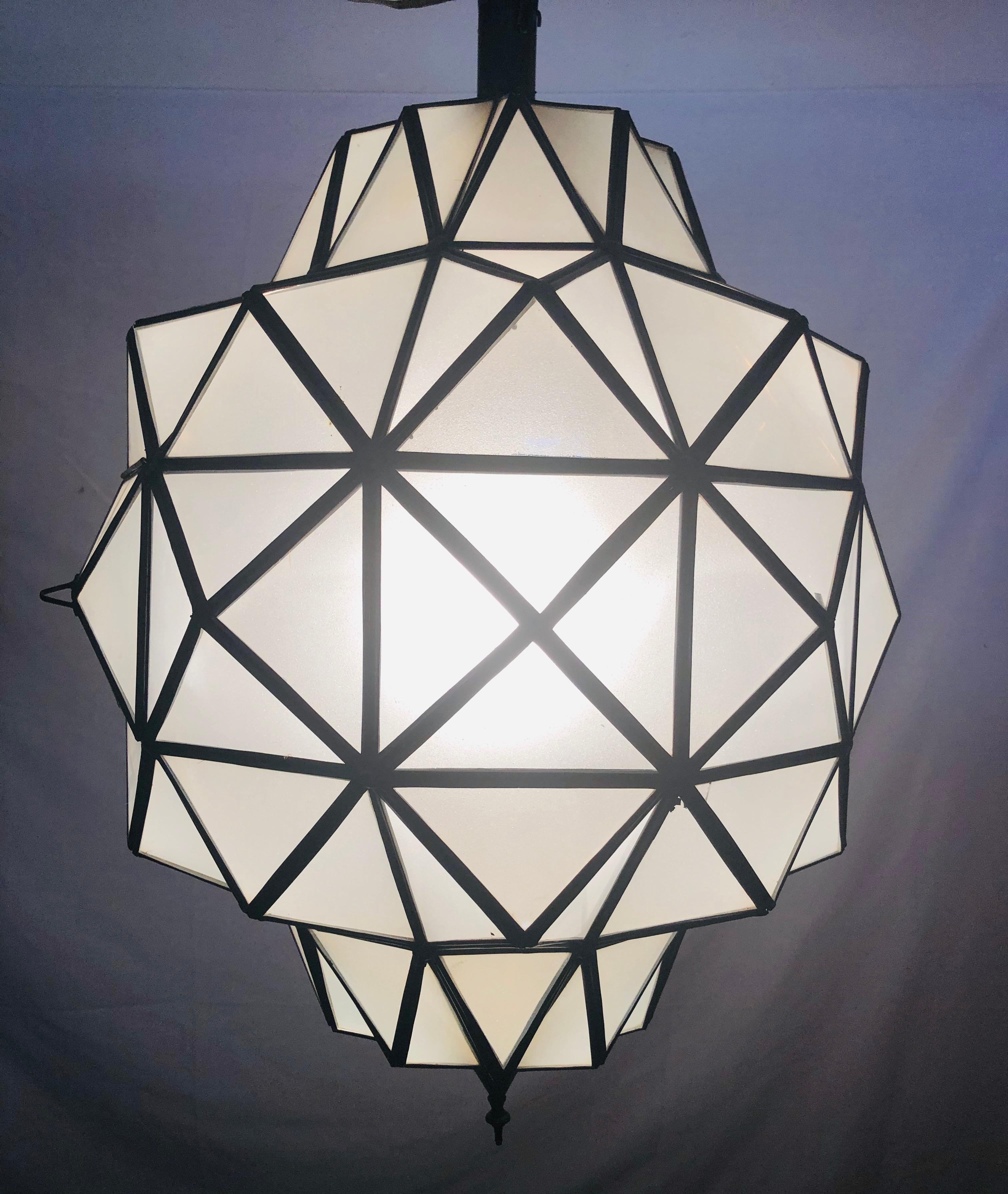 A stunning pair of Art Deco style dome form milk glass white chandeliers or lanterns. Each having individual panes, possessing an open door pane leading to a double recently wired setting housing 1 bulb. These fine custom lanterns are sure to light