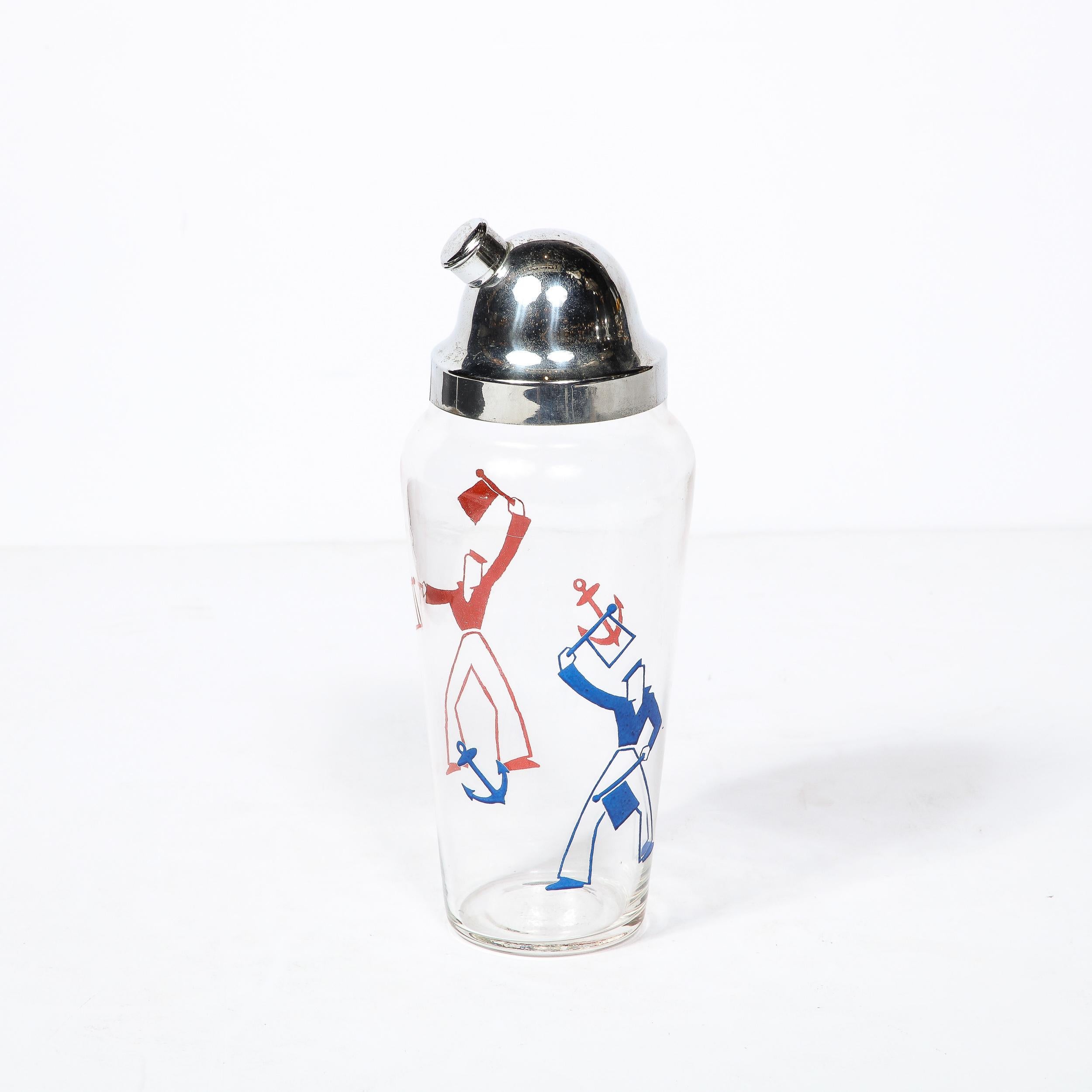 This Art Deco Cocktail Shaker originates from the United States Circa 1930. The Body of this piece is made in translucent glass with a charming motif of sailors in the Art Deco style waving flags rendered in blue and red enamel paint, as though