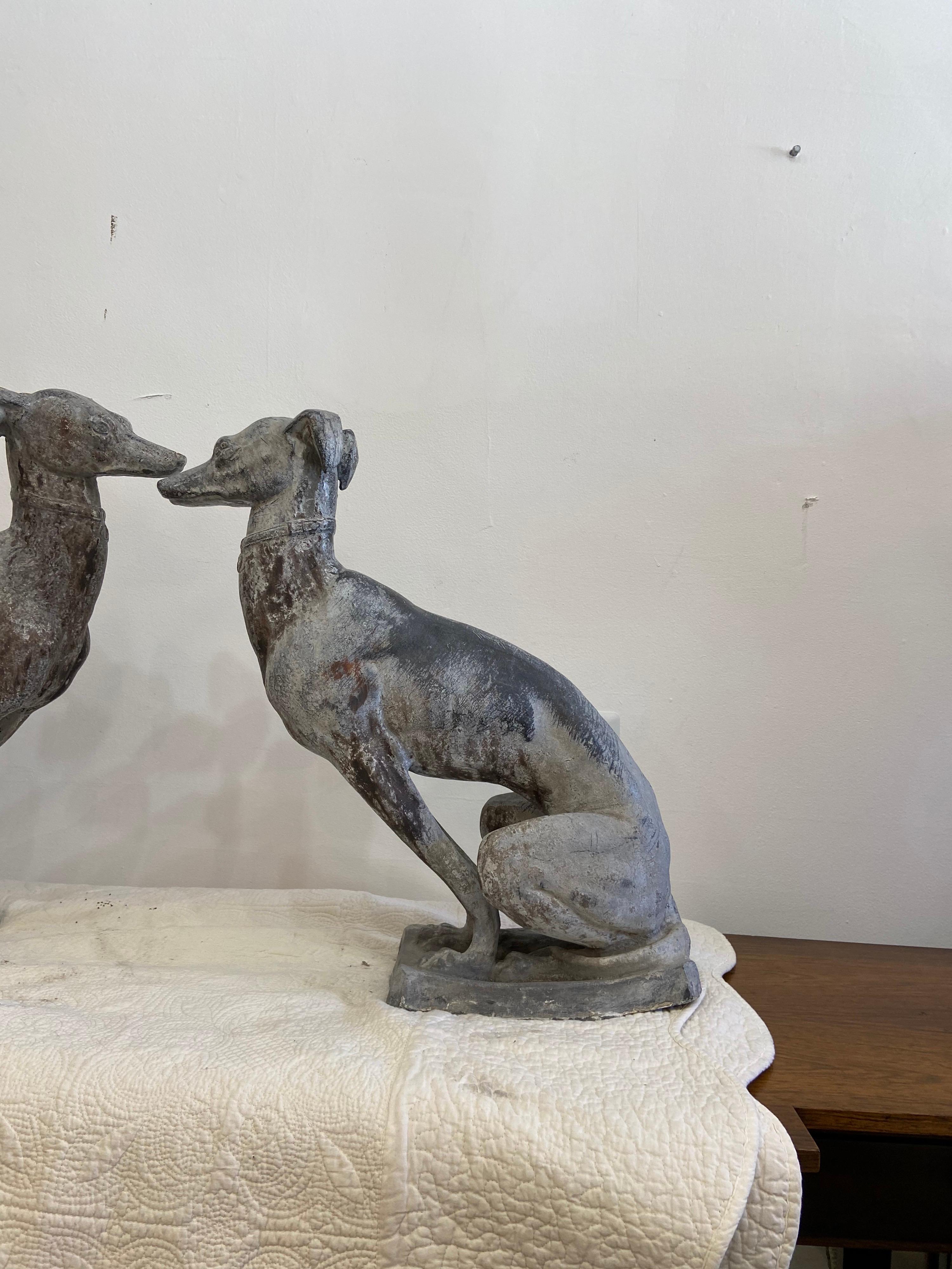 Pair of English Lead garden whippet dog sculptures from a Coral Gables estate these lead statues could be used many different ways including entry way pieces. Sculpture 19th century.