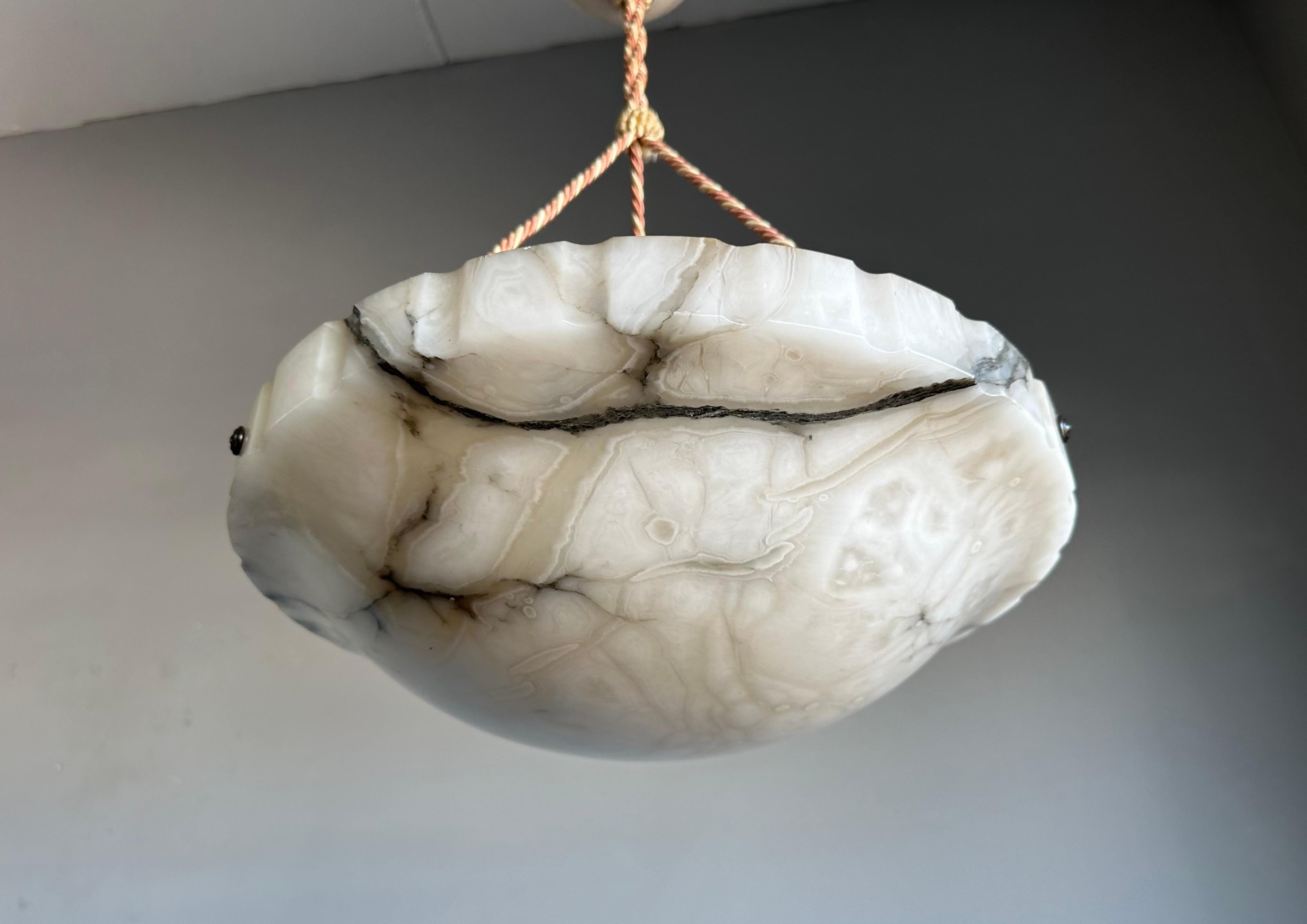 Wonderful Antique Art Deco alabaster pendant in mint condition.

Over the years we have sold some of the best looking and best condition alabaster pendants that money can buy. This perfectly white with black veins alabaster fixture is another one of