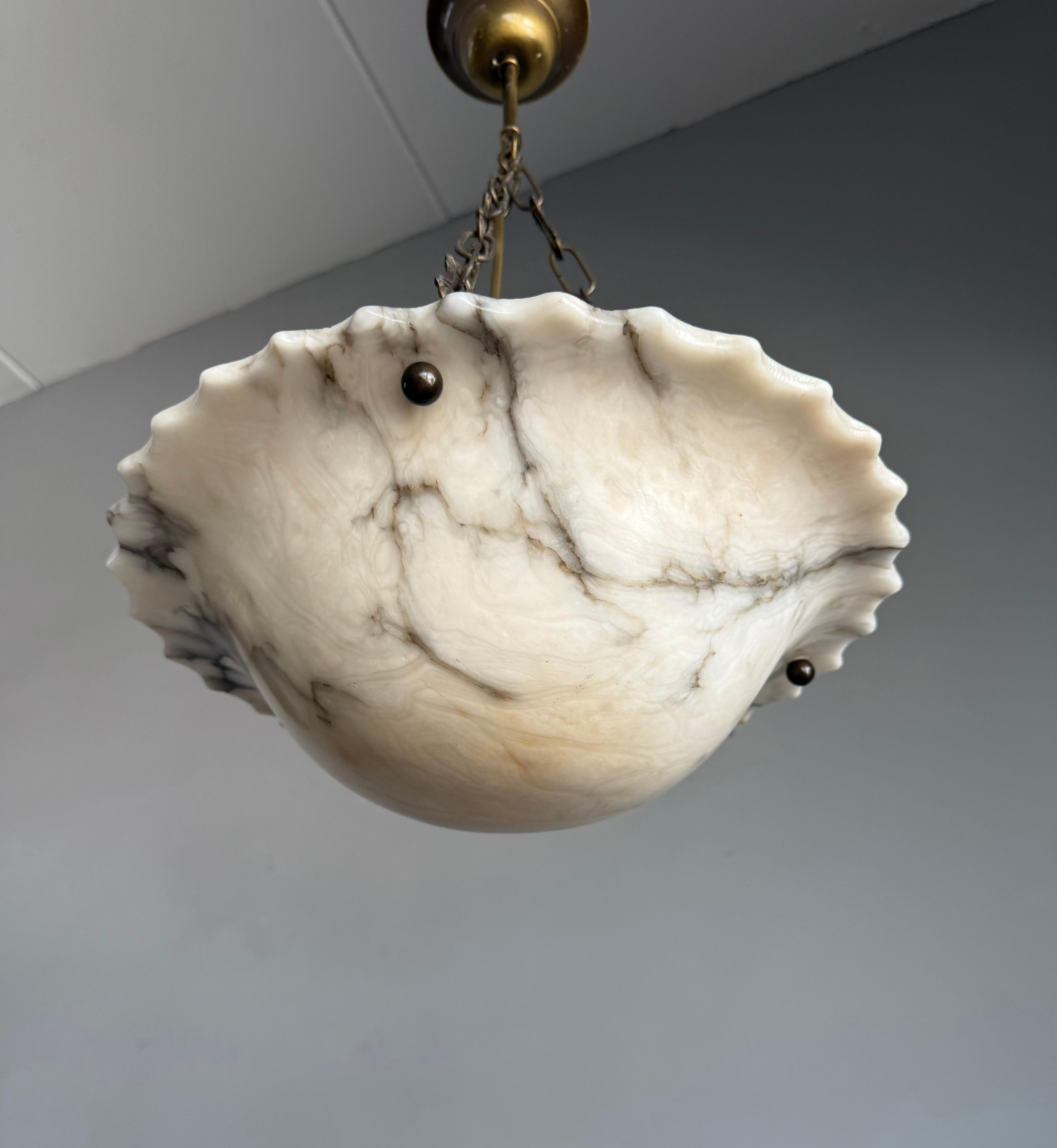 Note that we arrange the shipping ourselves to ensure a smooth, secure, and reliable delivery. This allows us to provide the best possible service and care for your purchase.

Exceptional French Art Deco Alabaster Pendant with Striking Veining and
