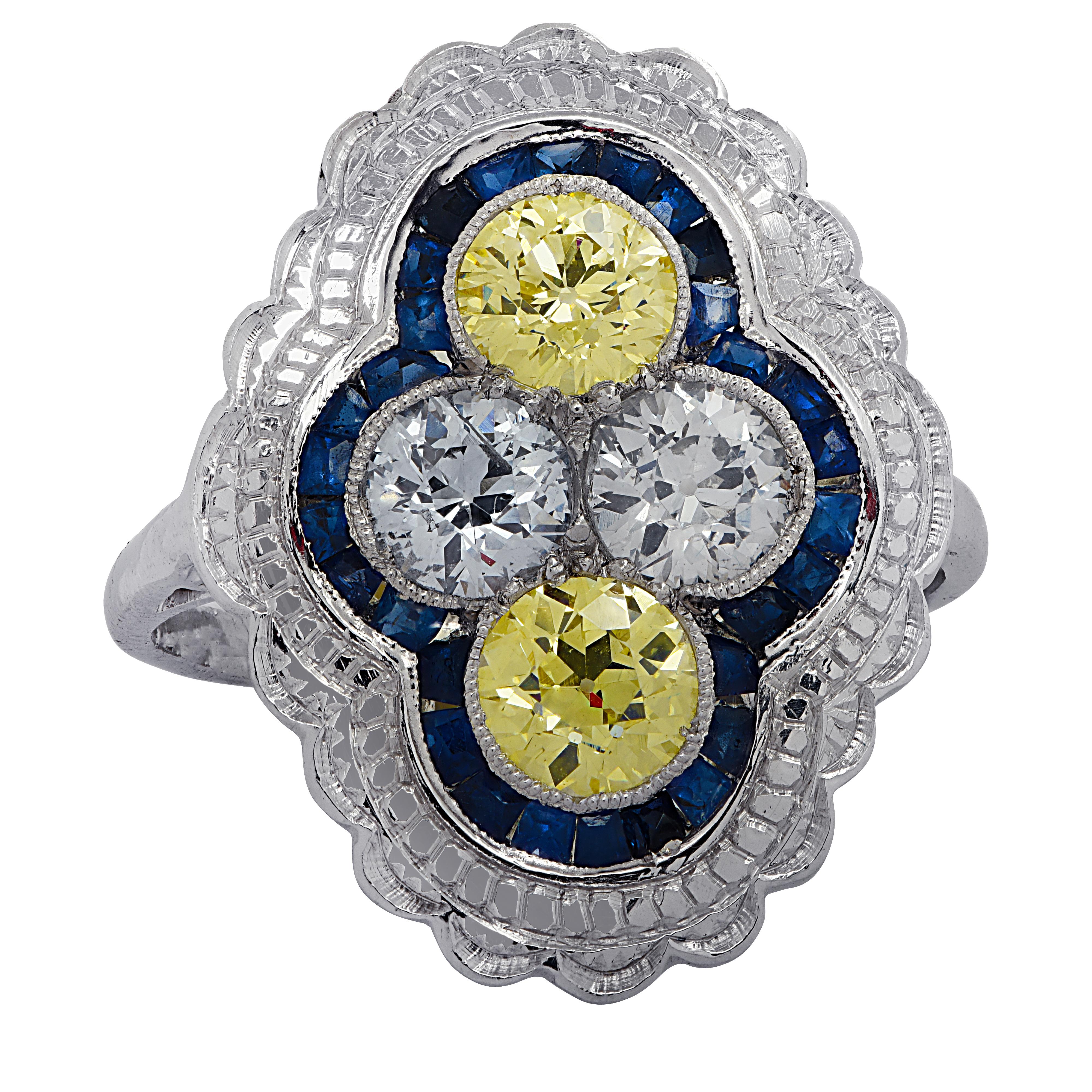Beautiful Art Deco Style ring crafted in platinum, featuring 2 Old European Cut diamonds weighing approximately  .80 carats total, G-H color, VS-SI clarity and 2 Old European Cut Fancy Yellow Diamonds weighing approximately 1 carat total, VS-SI