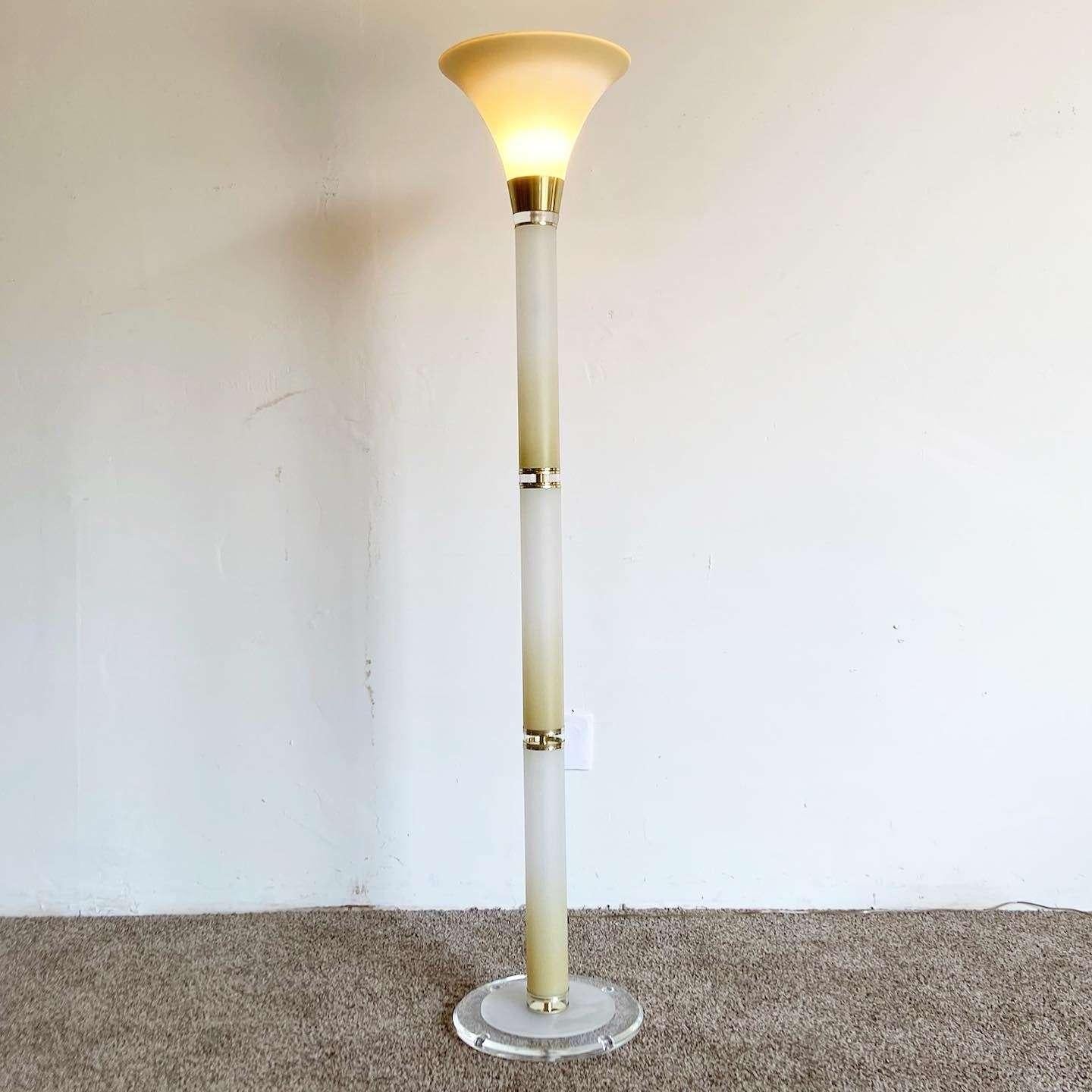 Amazing vintage art deco torchiere floor lamp. Features a white and tan finish with gold accents between the sections.
