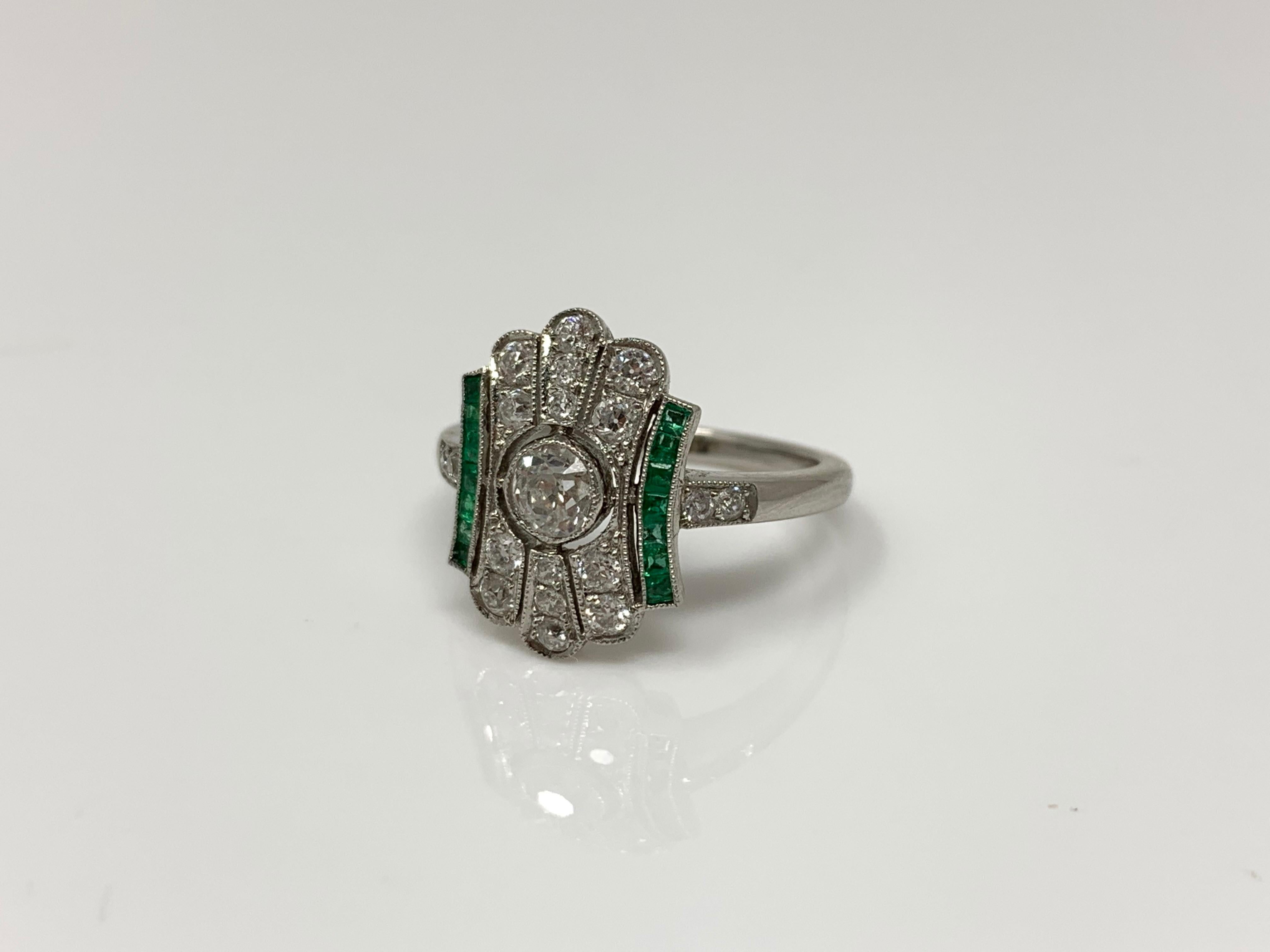 Women's  White Diamond and Emerald  Ring in Platinum.