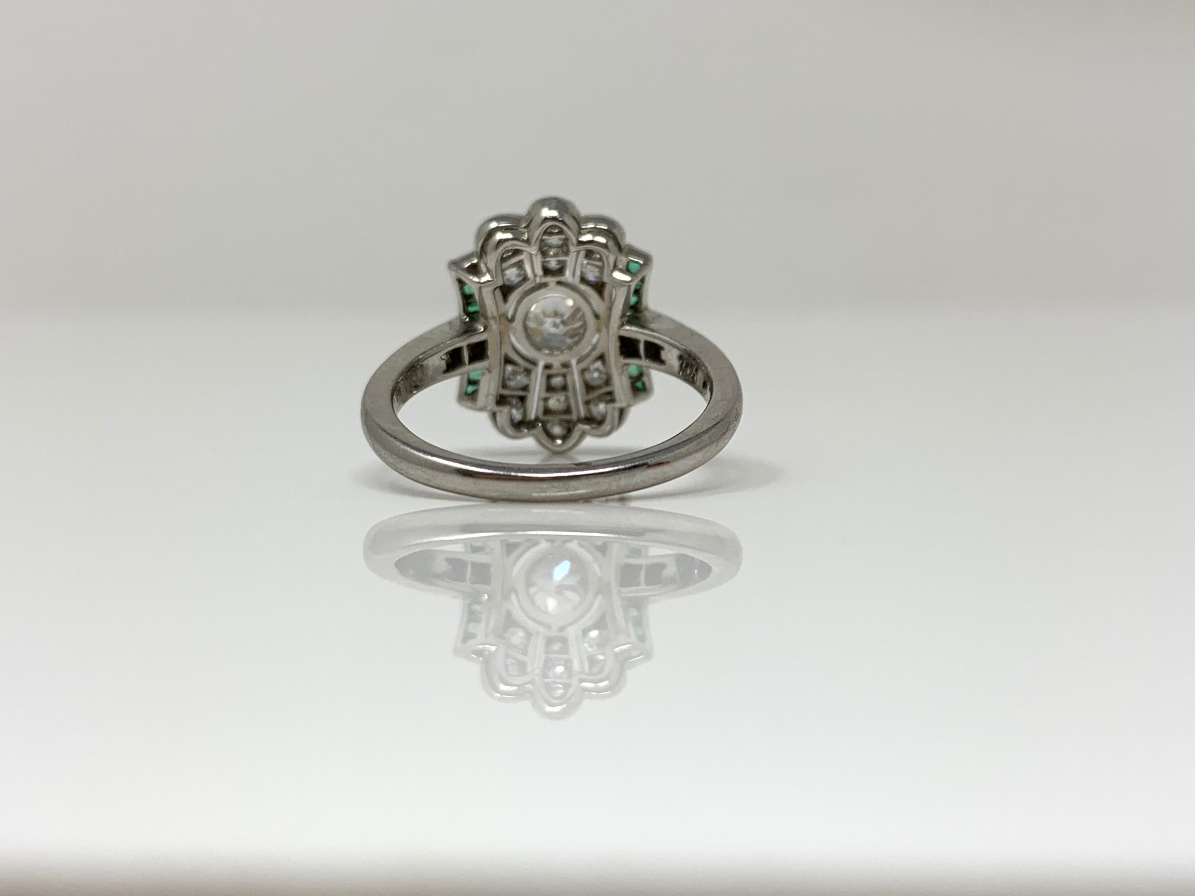  White Diamond and Emerald  Ring in Platinum. 1