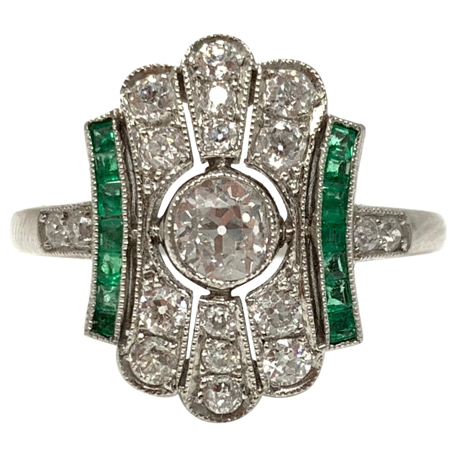  White Diamond and Emerald  Ring in Platinum.