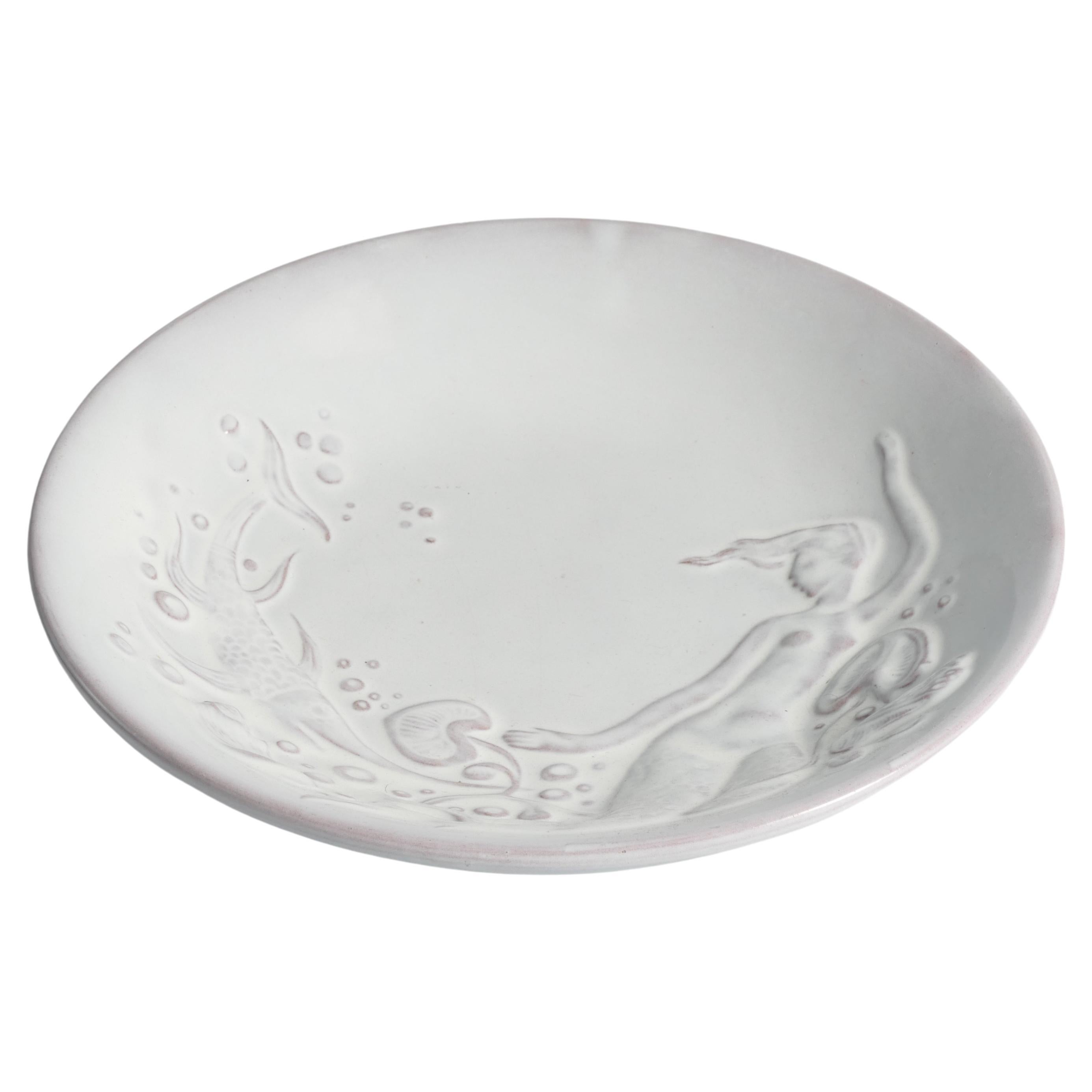 Rare art deco mermaid bowl created by Mari Simmulson for Upsala-Ekeby. The design features a swordfish, water lilies, bubbles, and a mermaid. The bowl's four feet intricately portray leaves from water lilies.

Manufacturer: Upsala-Ekeby

Designer: