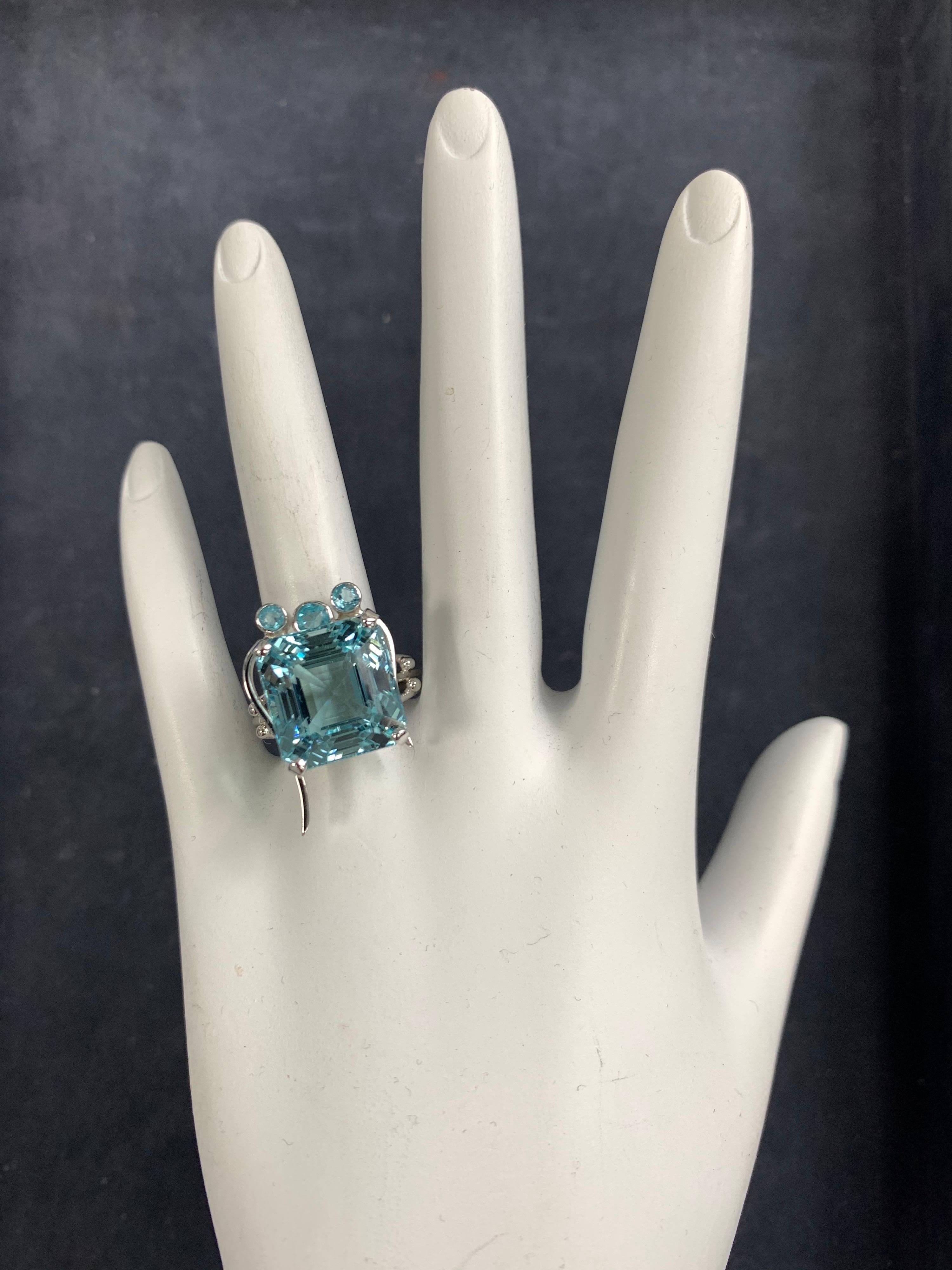 Stunning Art Deco Style 14k White Gold APX 15 Carat Natural Aquamarine Cocktail. 

The ring is set with a natural aquamarine center stone measuring approximately 13.3x12.6x11.6mm, weighing approximately 15 carats.

The ring is a size 7.25 and weighs