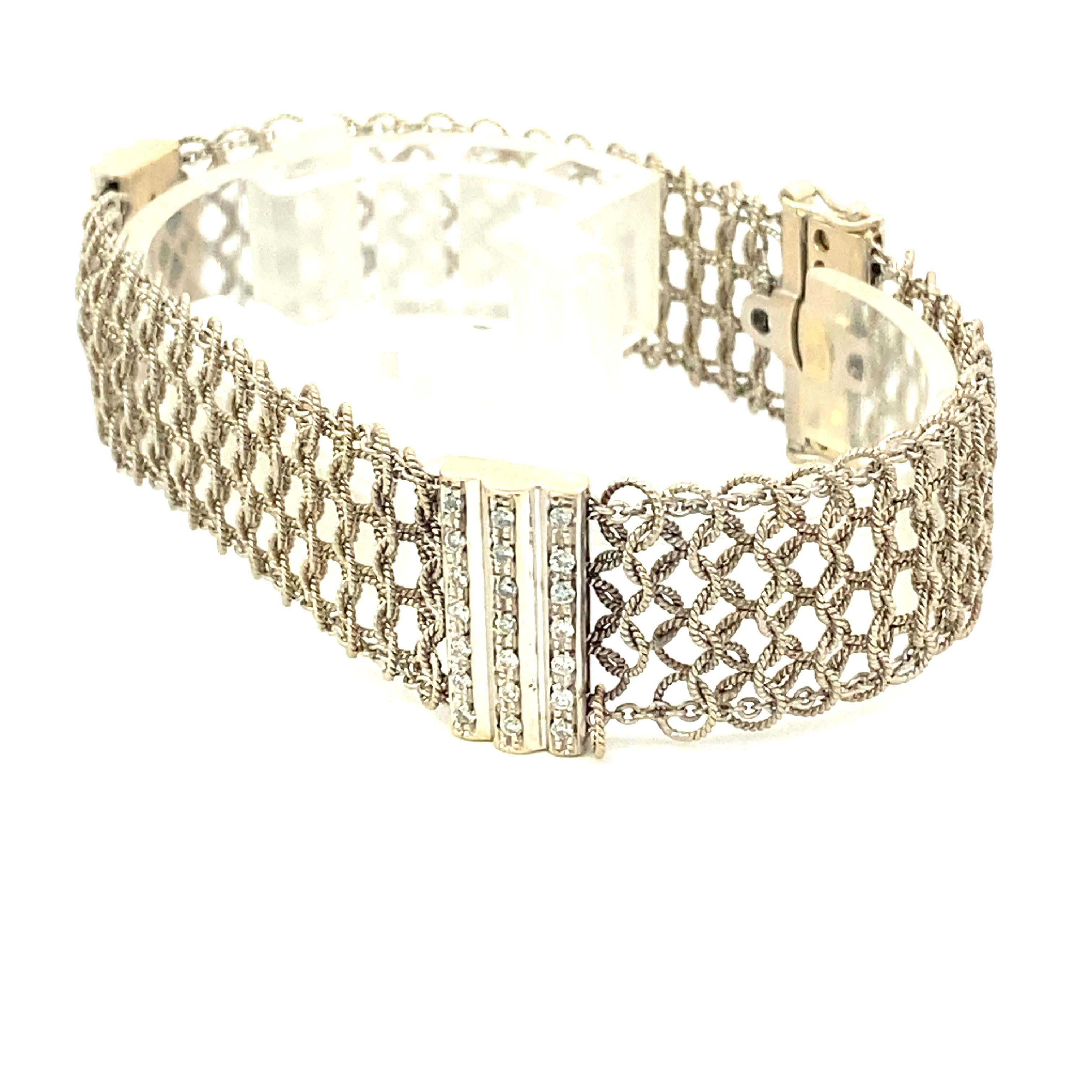 Art Deco 18k white gold mesh bracelet with 0.80 carat total weight diamonds, and 0.36 carat total weight cabochon sapphires with double safety eight clasp. 15.2Dwt. Length 7