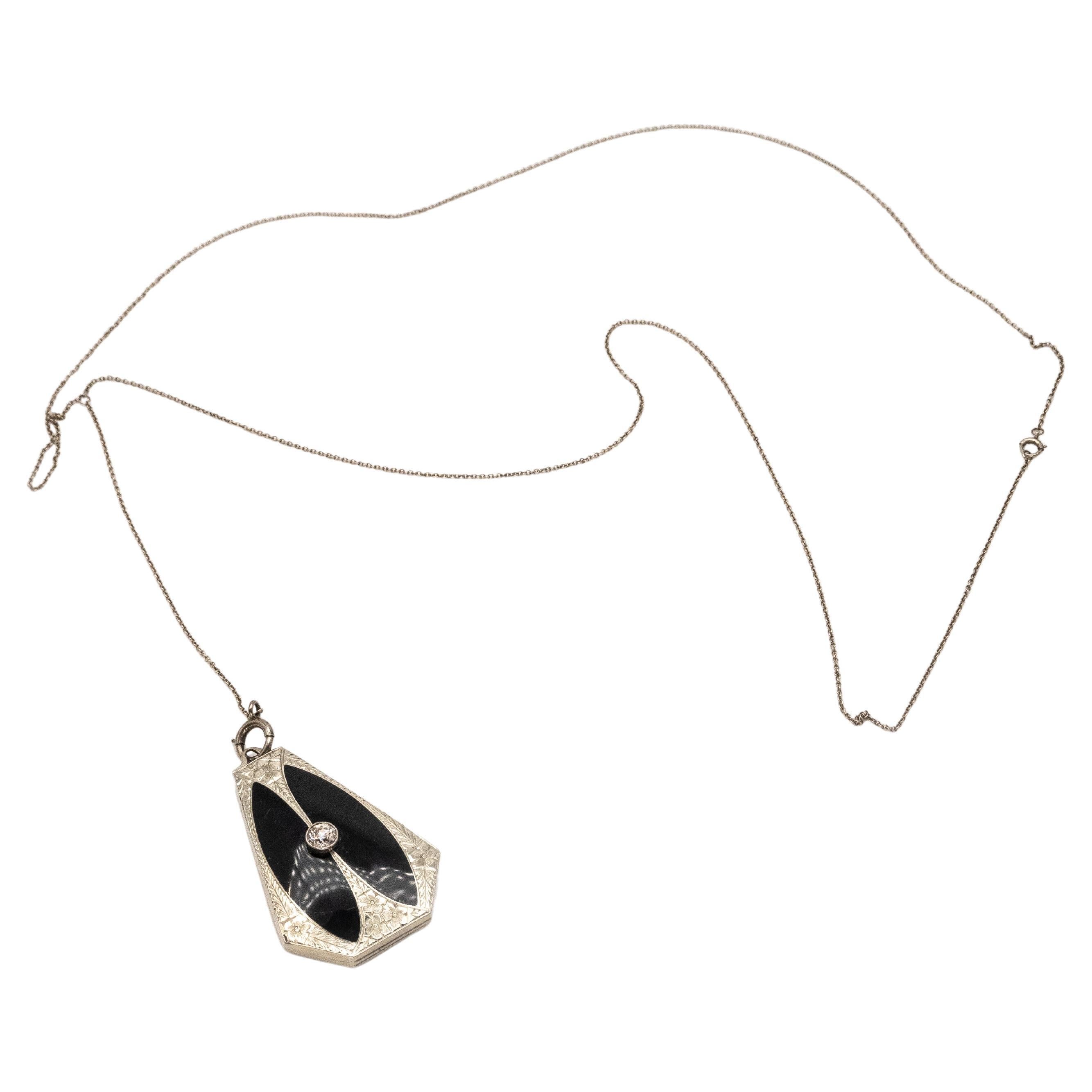 Rare Art Deco 14K white gold engraving onyx memorial Locket with 1 old European cut diamond on 14K white gold chain necklace

Approximate Weight: 20.1 grams
Approximate Diamond Weight: 0.45ct

Approximate Measurement:
Pendant: 42.5mm x 28mm
Chain: