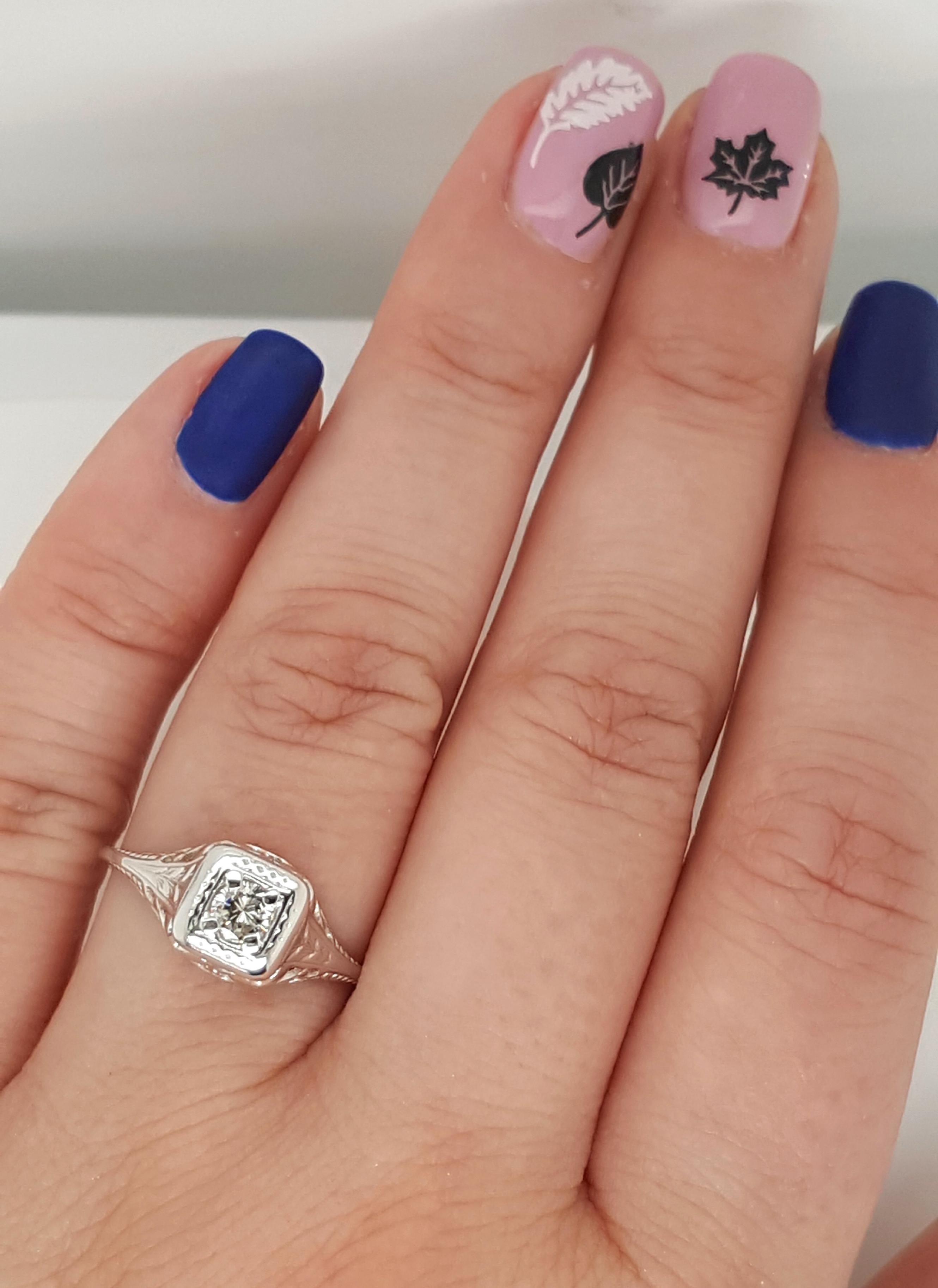 filigree solitaire engagement ring