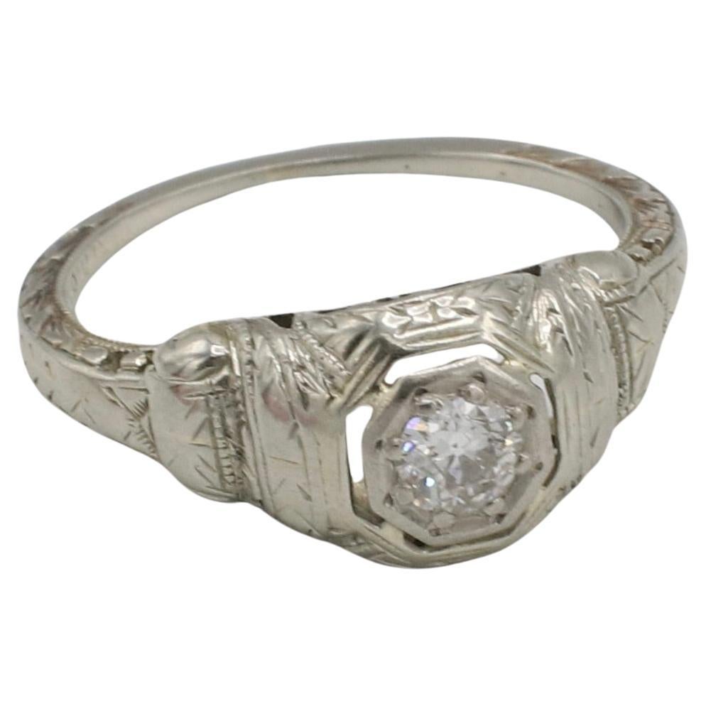 Art Deco 18 Karat White Gold Old European Cut Natural Diamond Engagement Ring 
Metal: 18k white gold
Weight: 2.01 grams
Diamond: Approx. .15 carat old European cut I SI1 natural diamond
Height: 5mm
Size: 4.75 (US)
