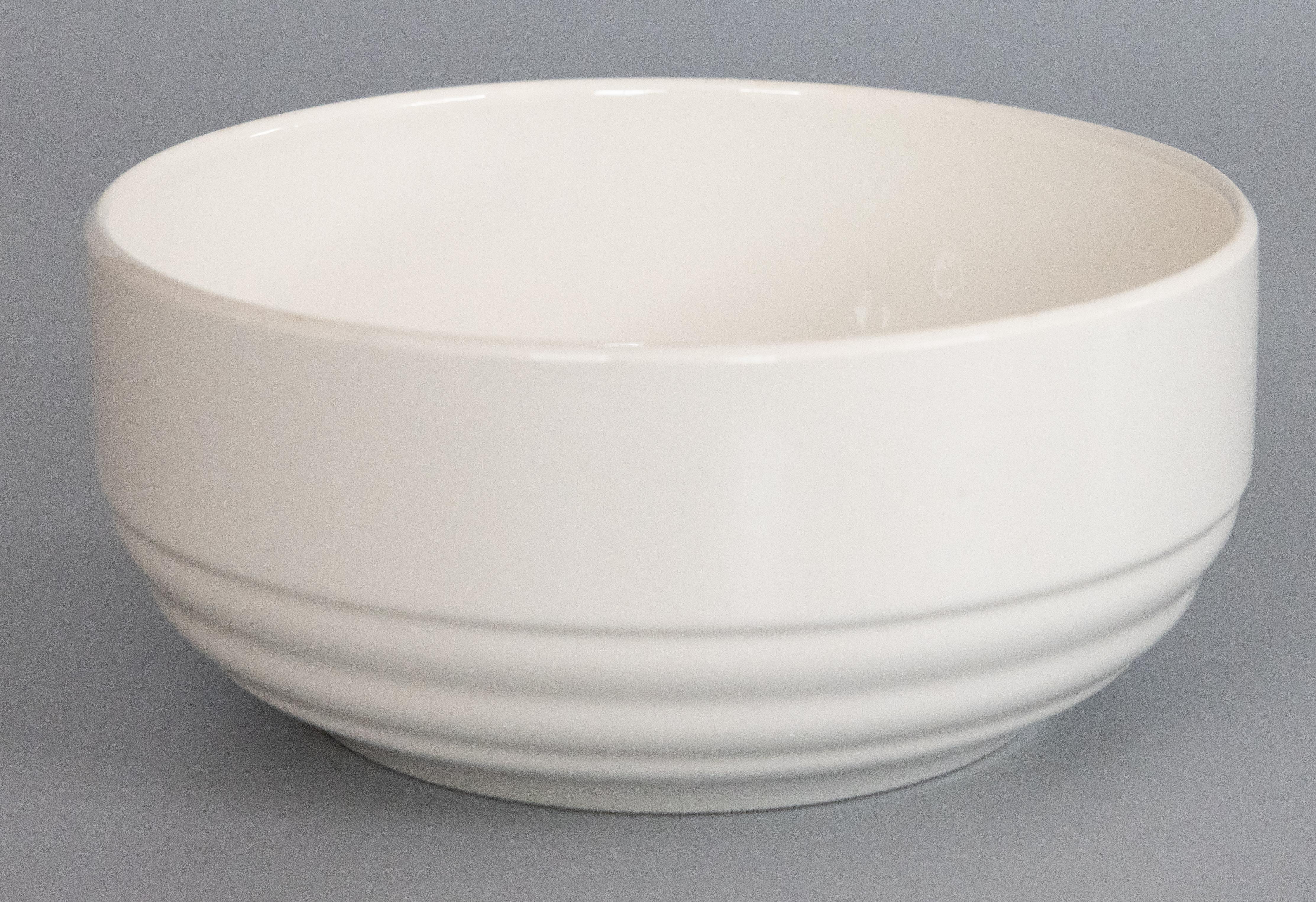 A lovely antique Art Deco white ironstone bowl by Boch Frères La Louvière, Belgium, circa 1920. Maker's mark on reverse. This sleek and stylish bowl has simple clean lines, perfect for the modern home and would be a wonderful addition to an