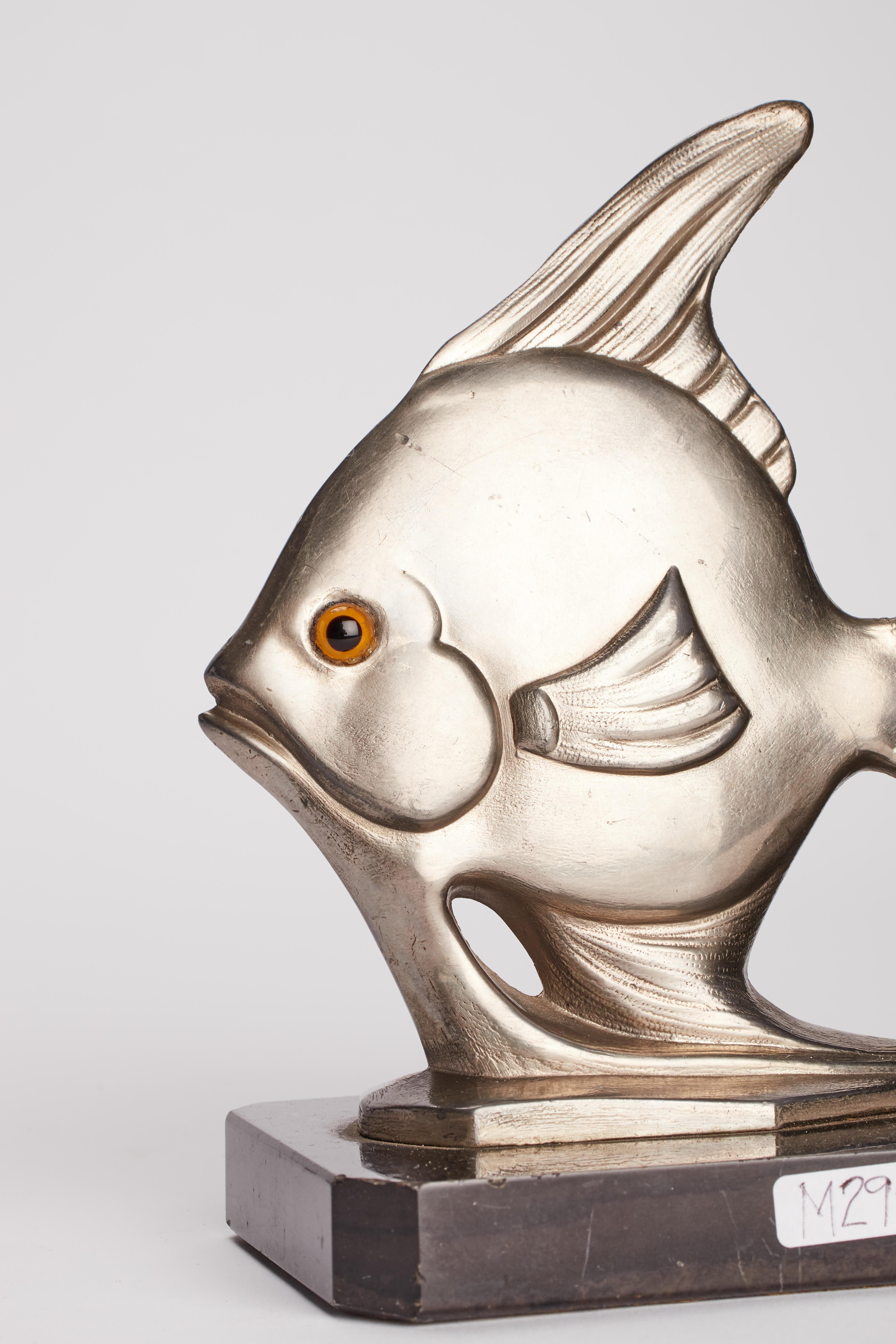 20th Century Art Déco white metal bookends depicting a fishes, France 1930.  For Sale
