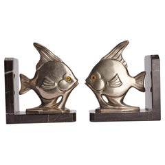 Art Déco white metal bookends depicting a fishes, France 1930. 