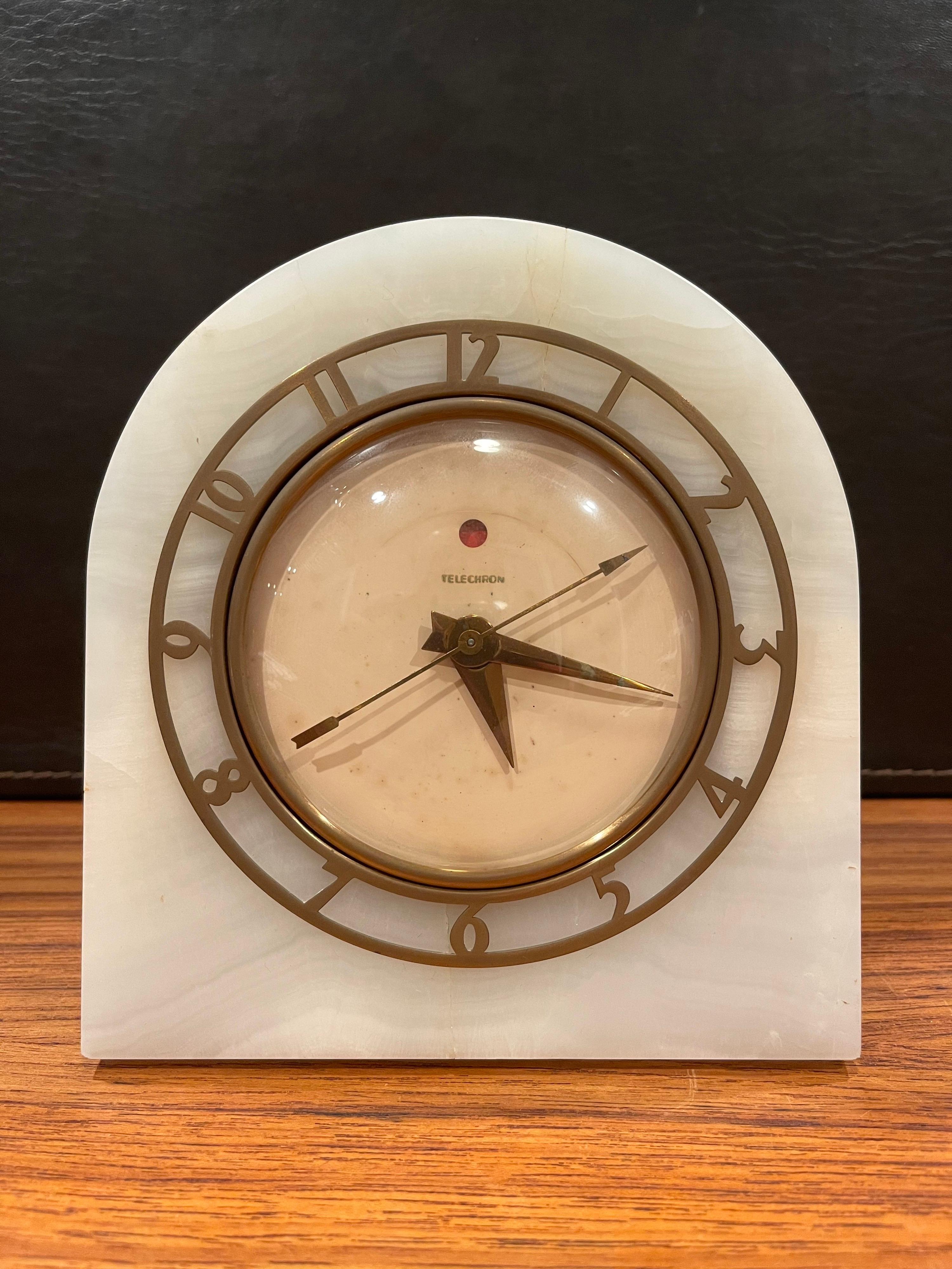 Art Deco white onyx electric mantle clock known as the 