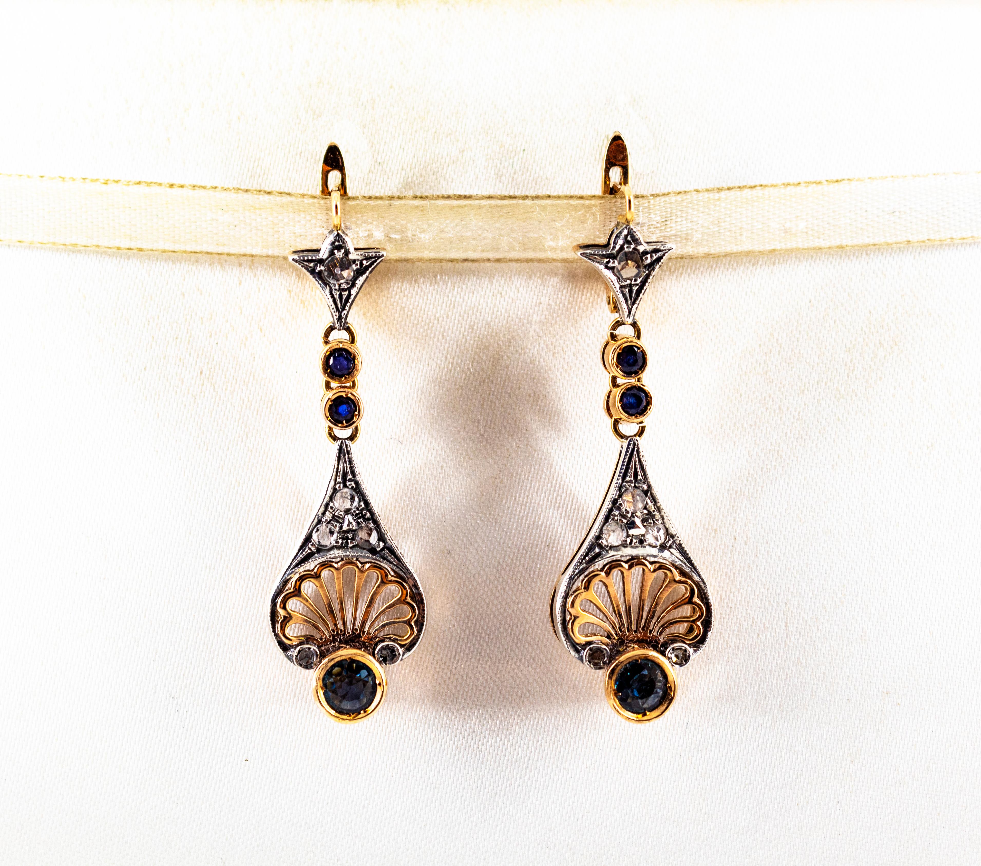 These Lever-Back Earrings are made of 9K Yellow Gold and Sterling Silver.
These Earrings have 0.30 Carats of White Rose Cut Diamonds.
These Earrings have also 1.00 Carat of Blue Sapphires.
These Earrings are available also with Rubies or
