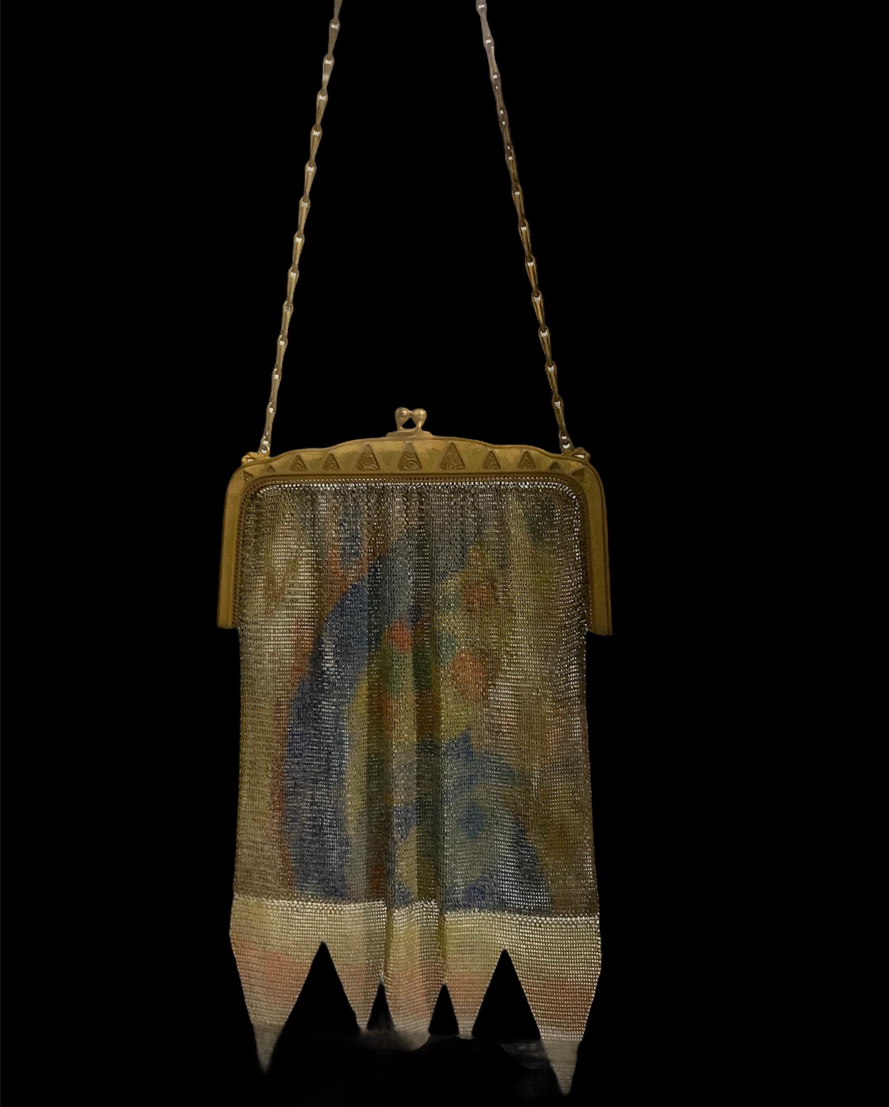 This is an Art Deco Whiting & Davis Dresden mesh evening purse. It is enamel hand painted with royal blue, yellow, orange and green colors featuring an “impressionist“ pattern. It ends with five arrows shaped fringe at the bottom. It has a gold tone