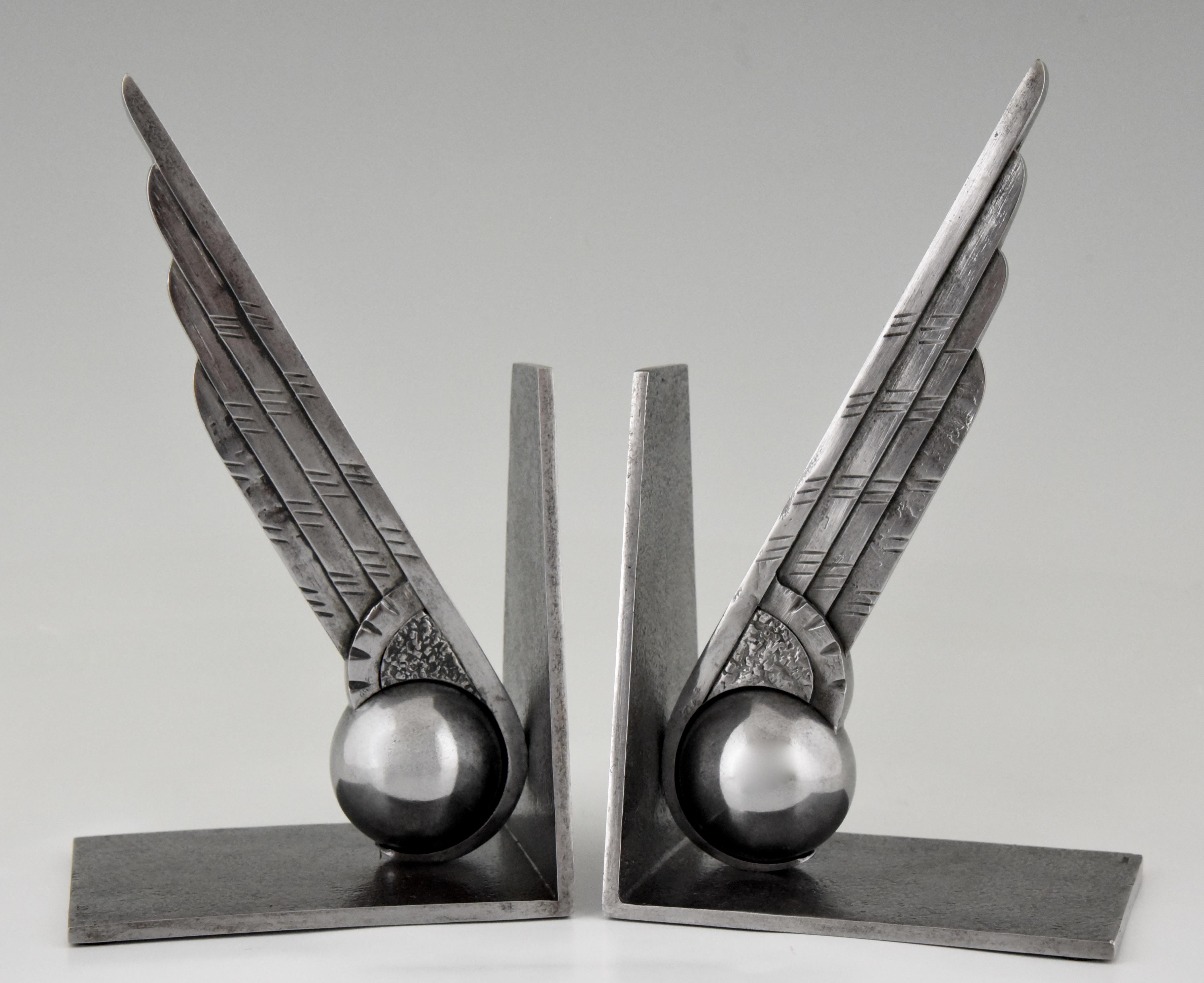 silver bookends in the shape of a single wing