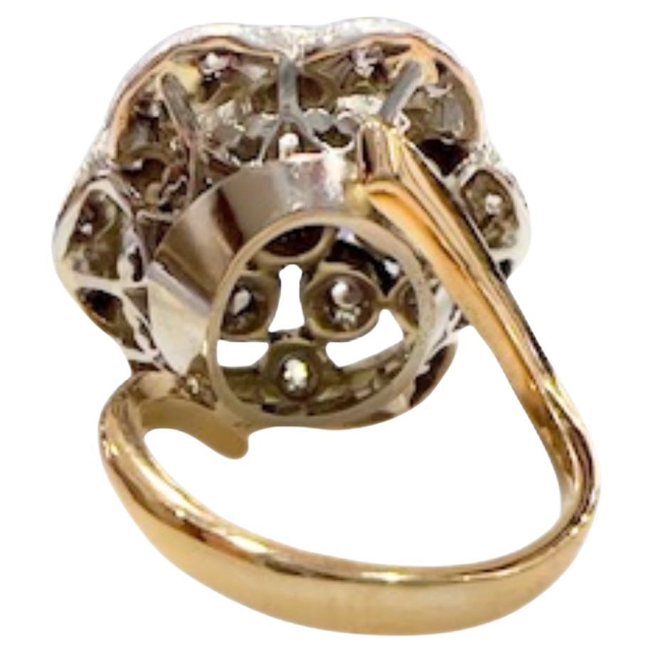 A rare and beautiful Art Deco ring from the 1925-1930 period, crafted in 18k gold and 925 silver, featuring antique-cut diamonds and a central emerald. A true vintage masterpiece.

**IN STOCK**

Technical Specifications:

Metal: 18k Gold & 925