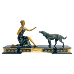 Art Deco  with stylized Spelter Representation of Dog and Women on Marble Plint
