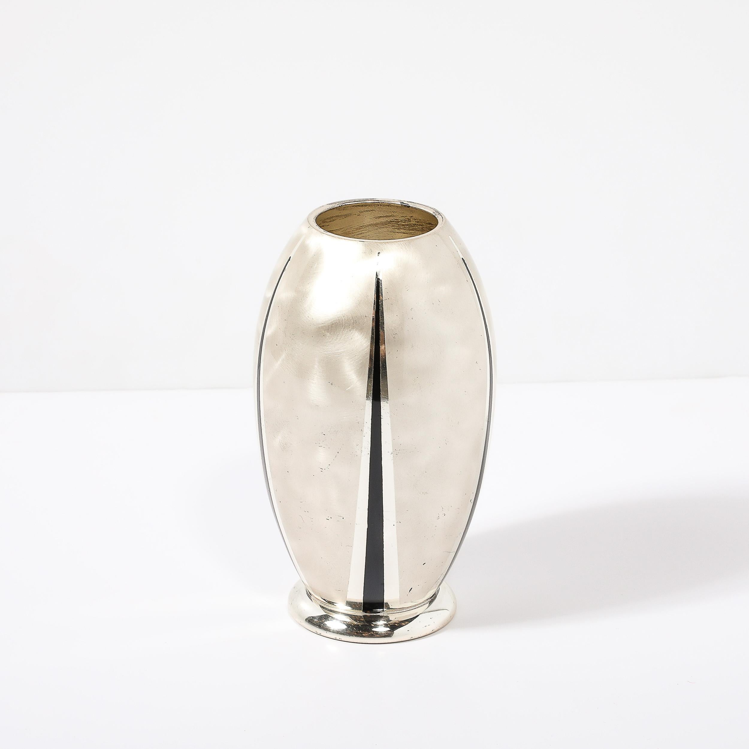 This well balanced and stunningly finished Art Deco MF Ikora Textural Silver Plated Vase W/ Jet Black Linear Detailing originates from Germany, Circa 1935. Featuring and urn form rounded composition resting on a cylindrical base, the piece features