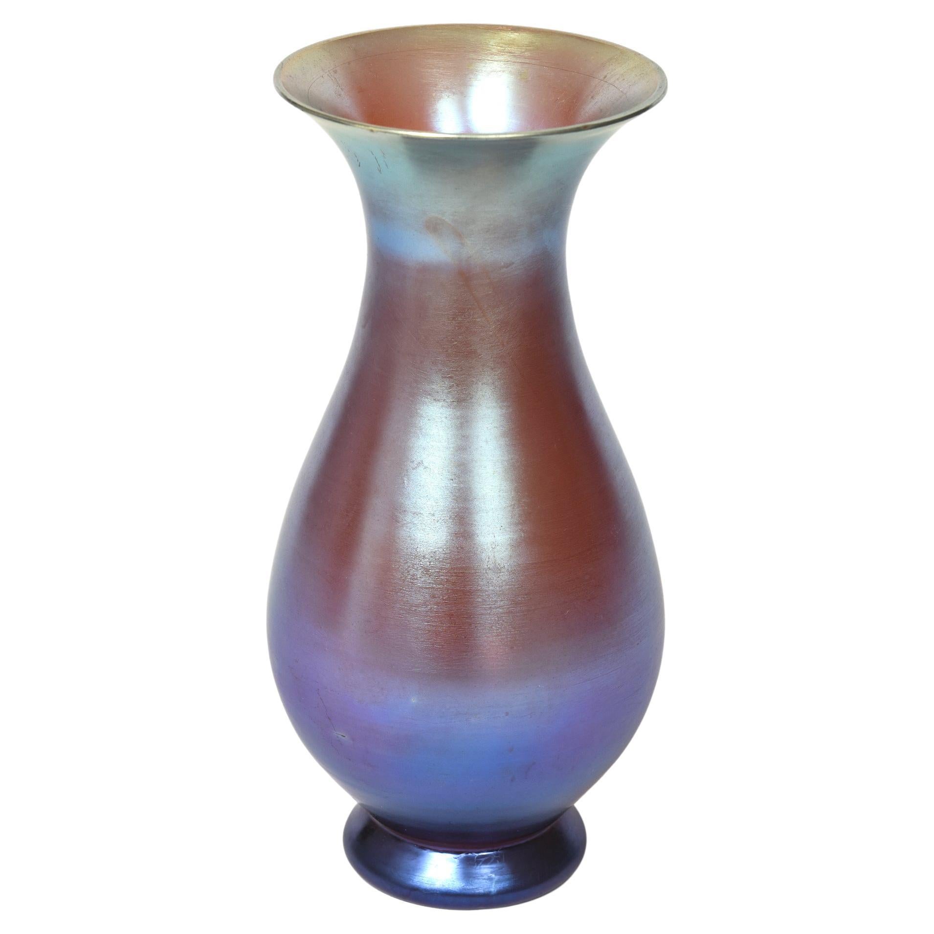 Beautiful iridescent Art Deco vase attributed to WMF from the 1930s

Biography from the Glass Museum:

Although WMF produced glass for more then 100 years, their period of triumph in glass only lasted from 1926 to 1936. WMF, or the