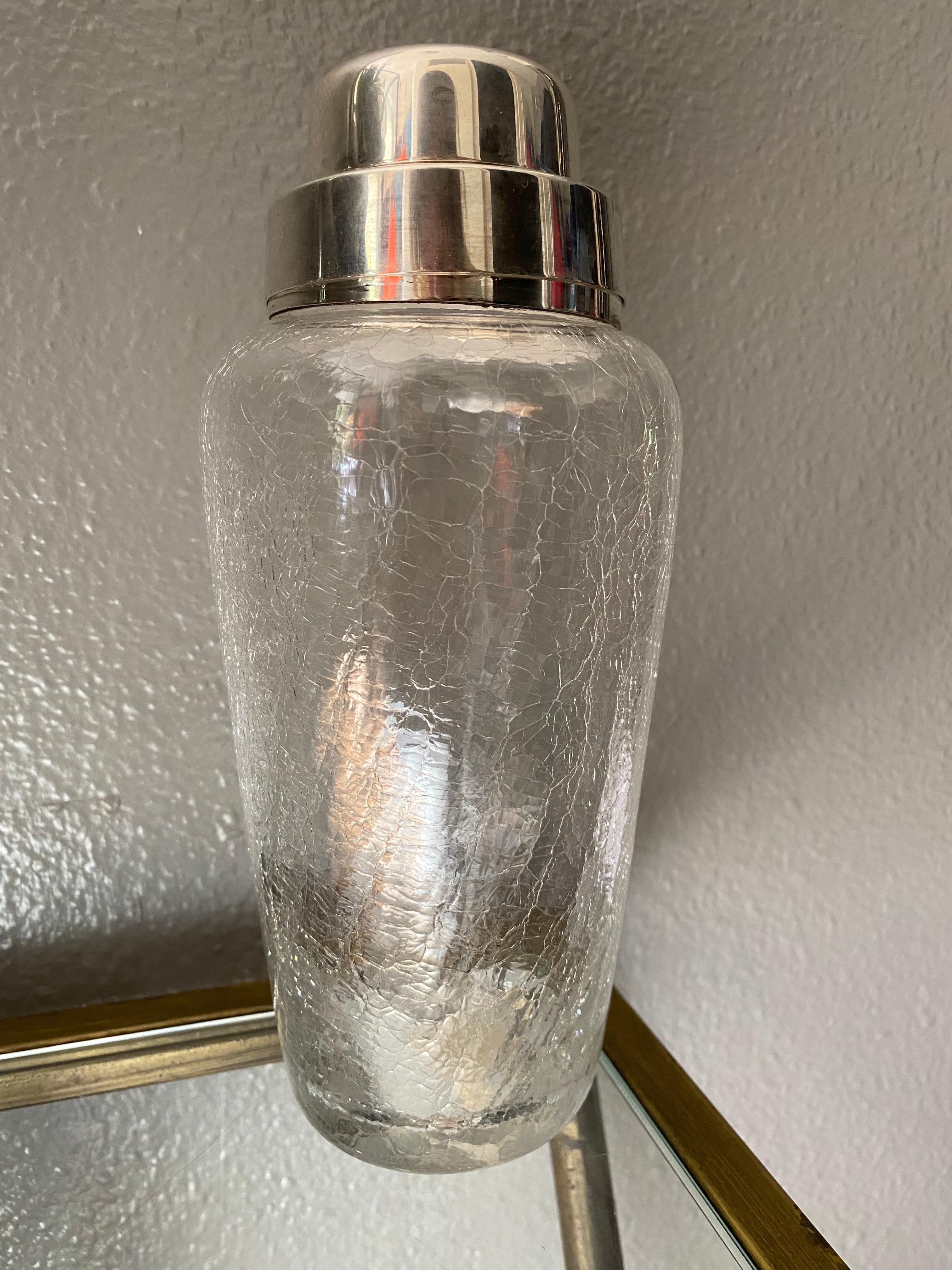 This chic bar accessory is made by the renowned manufacturer WMF. The shaker is in a very good condition. The shaker has a removable cap and strainer. It is marked underside the cap with legal silversmith hallmarks reading NS - WMF. NS stand for