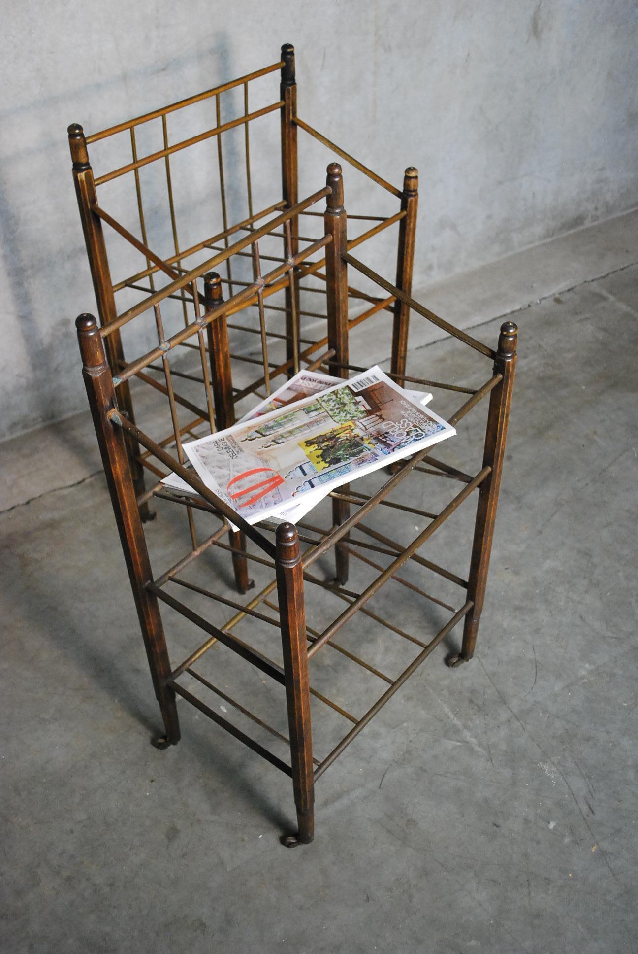 This Art Deco magazine stand was produced by Ernst Rockhausen & Söhne. Its frame is made of mahogany and it has brass tubes to carry your magazines. It sits on four wheels, elegant piece in original patina, would be both a practical as a decorative