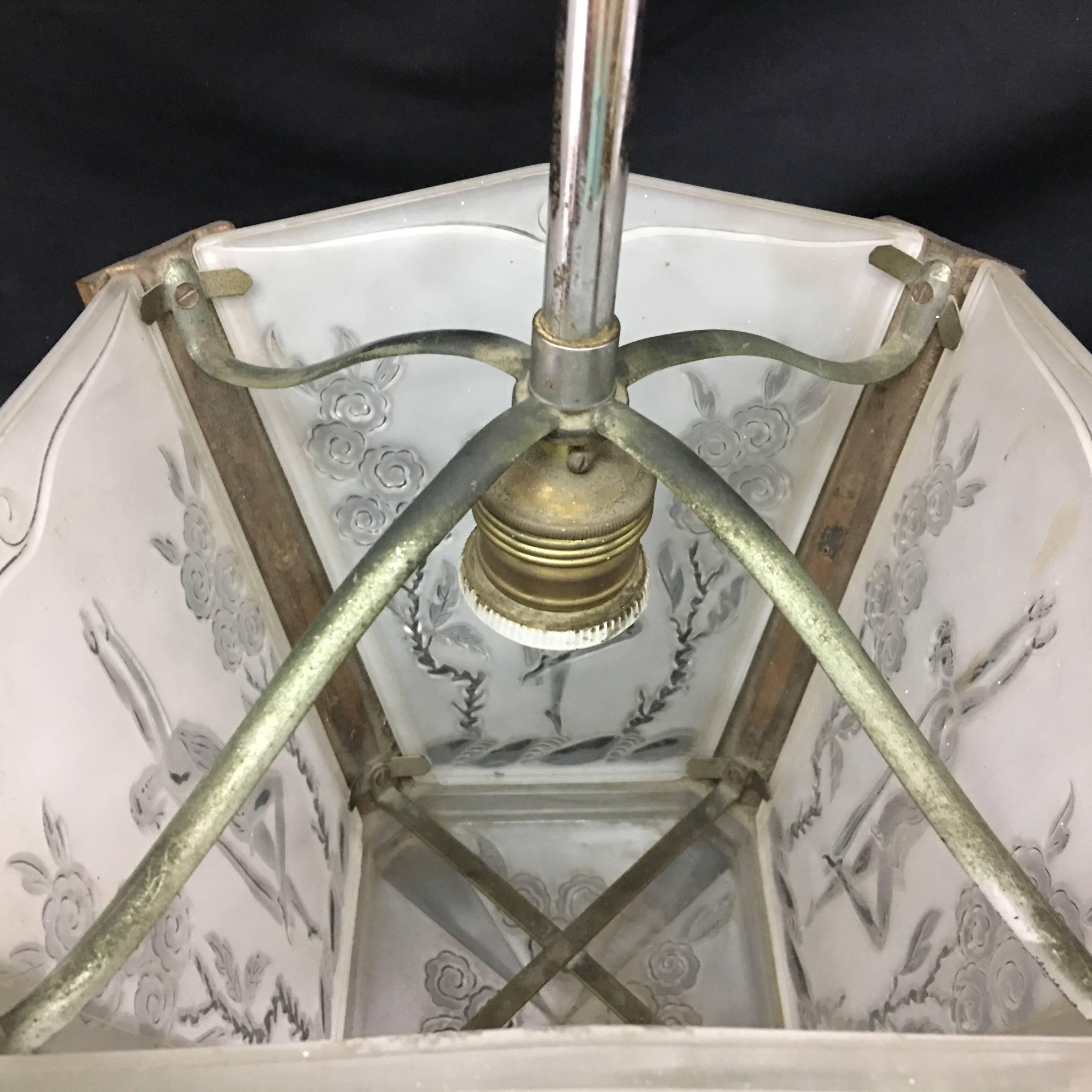 Amazing Art Deco pendant, in wood, metal and engraved glass in perfect conditions, fully restored electrical parts, it works 110-240 volts and needs regular e27 bulb.The italian pendant is a remarkable piece that reflects the elegance and